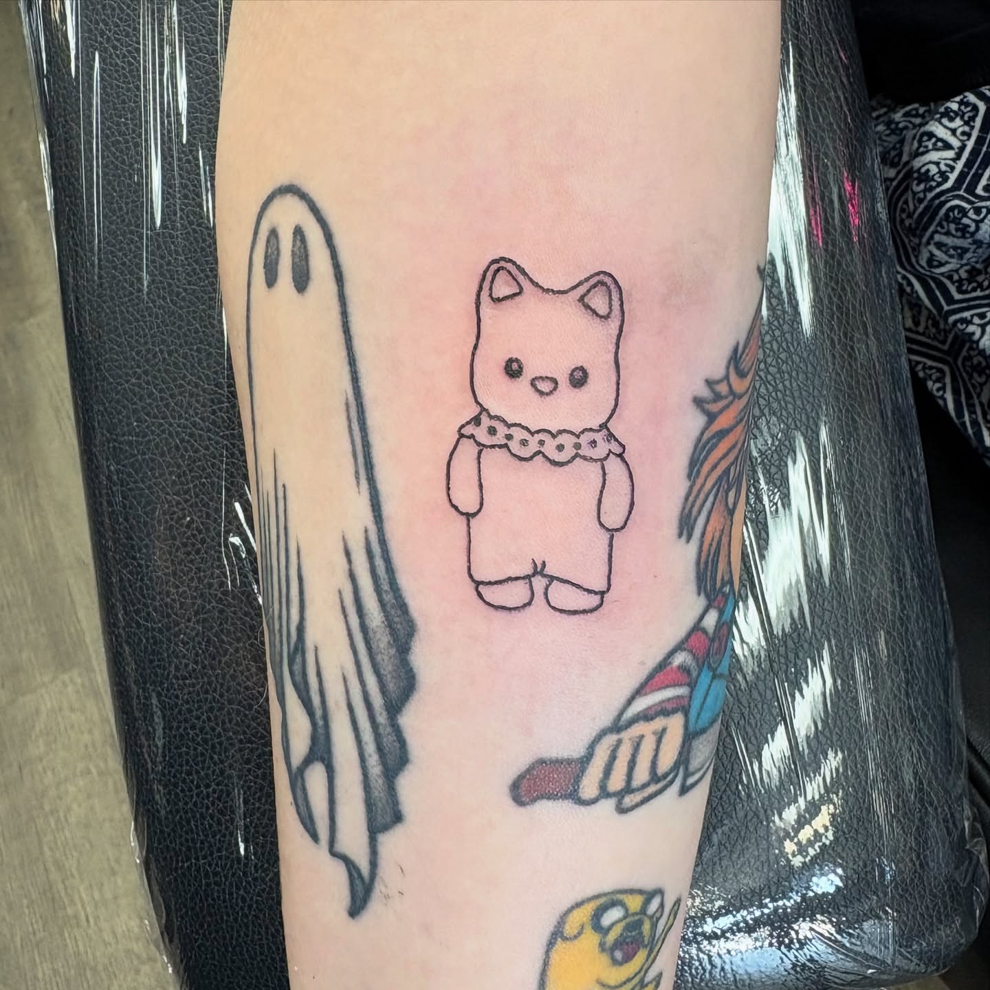 Ghost, teddy bear, unicorn dotwork tattoo on the forearm by Tori Anderson, Minneapolis, Minnesota