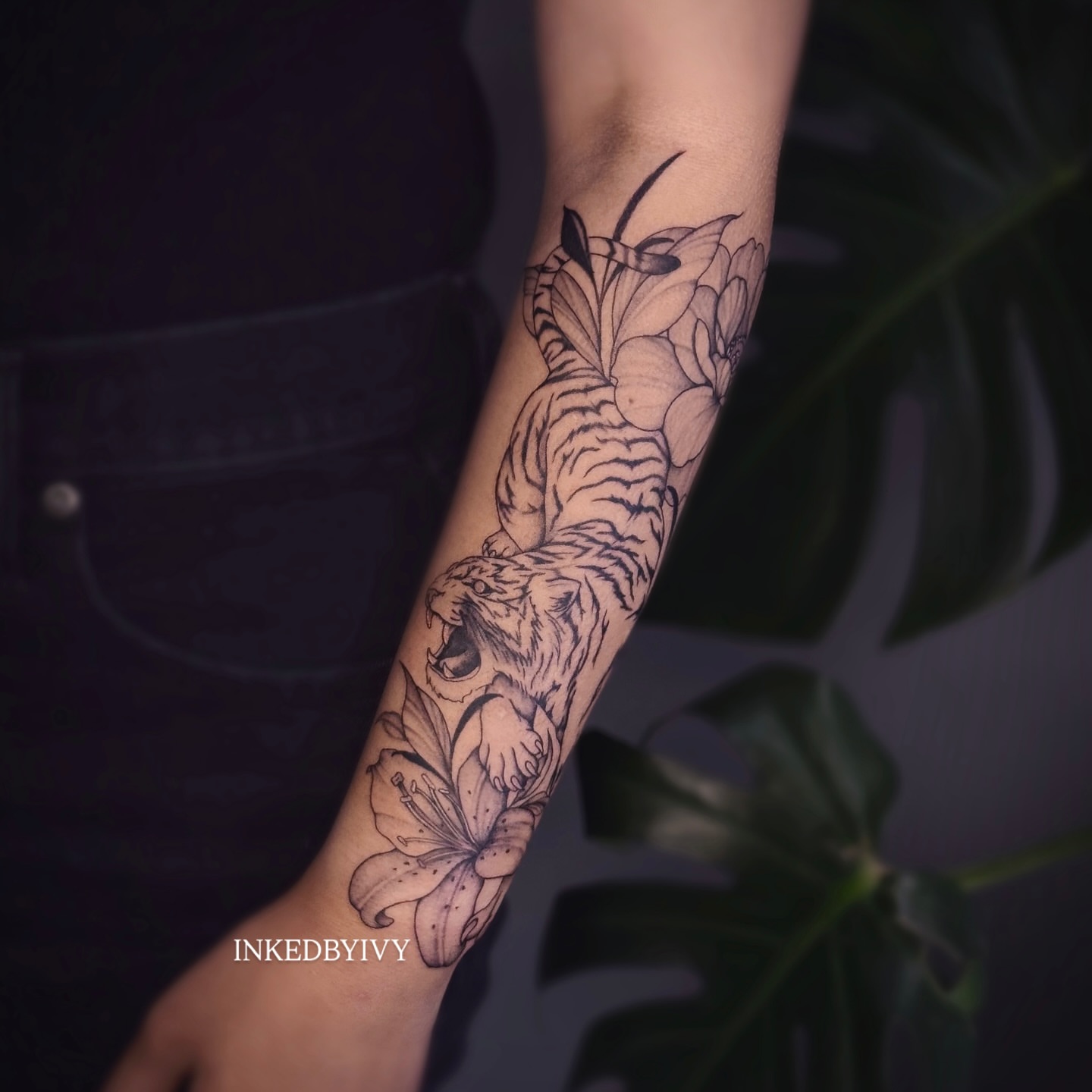 Tiger and lily realism tattoo on the forearm by IVY