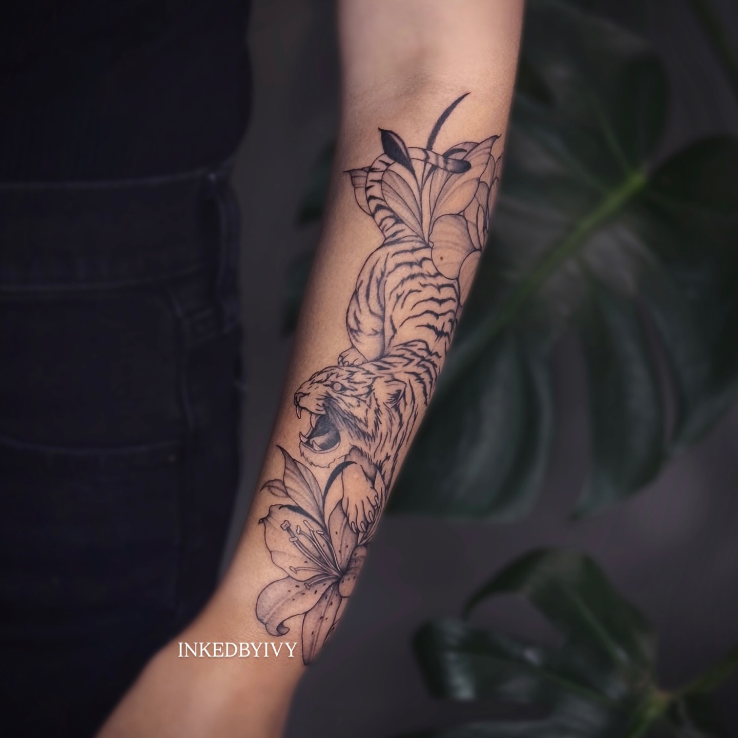 Tiger and lily realism tattoo on the forearm by IVY