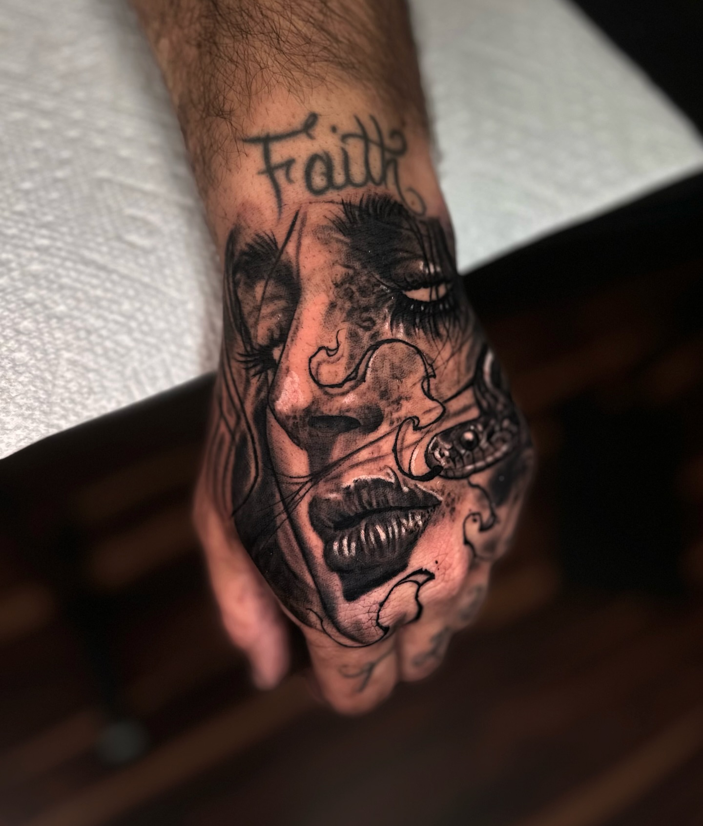 Face realism tattoo on the hand by Jesse White, Mentor, Ohio