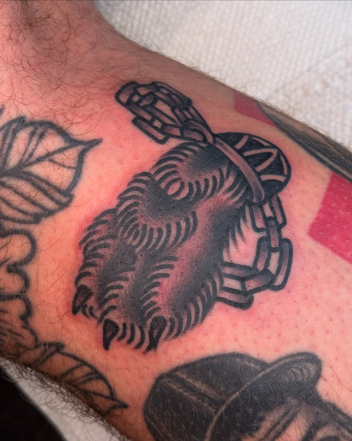 Crab black and grey tattoo on the forearm by Tony Kaplan