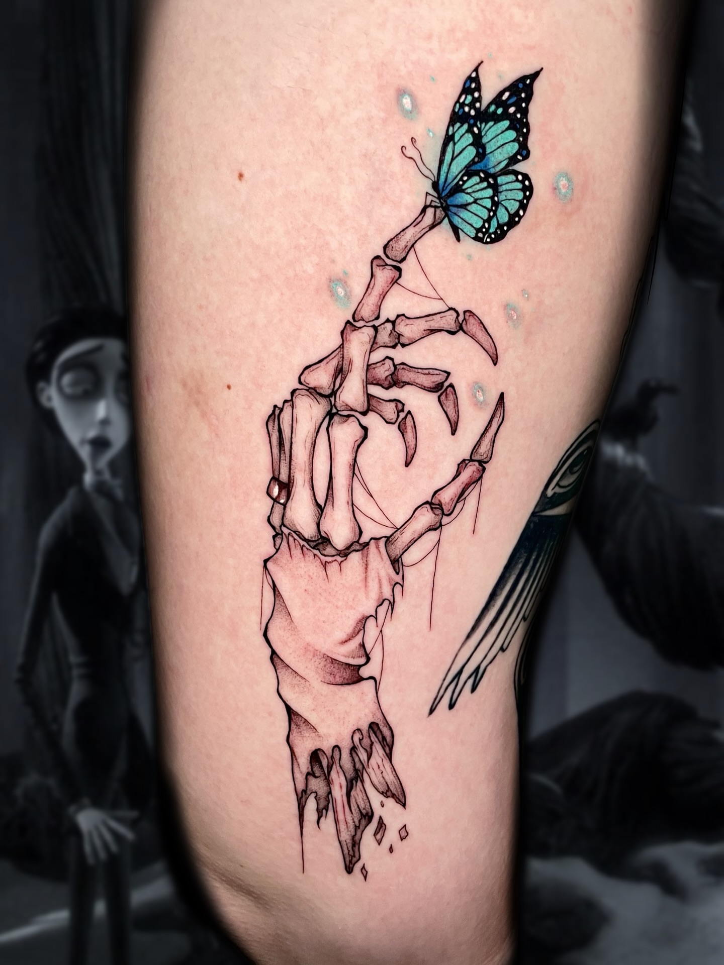 Skeleton hand with butterfly dotwork tattoo on the forearm by Shontel Fowler