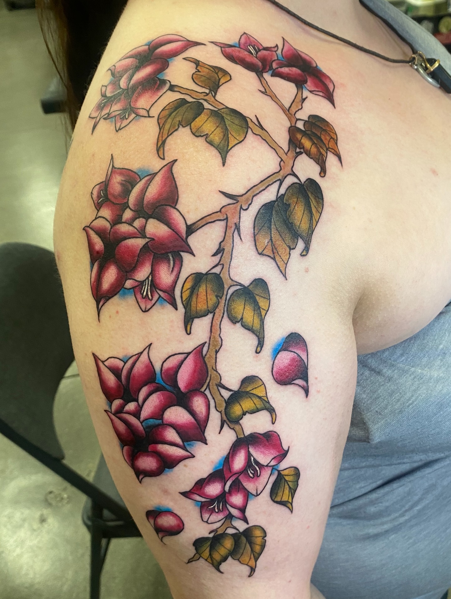 Flower bouquet American traditional tattoo on the shoulder by Ashley Lin Las Vegas Tattoo Artist
