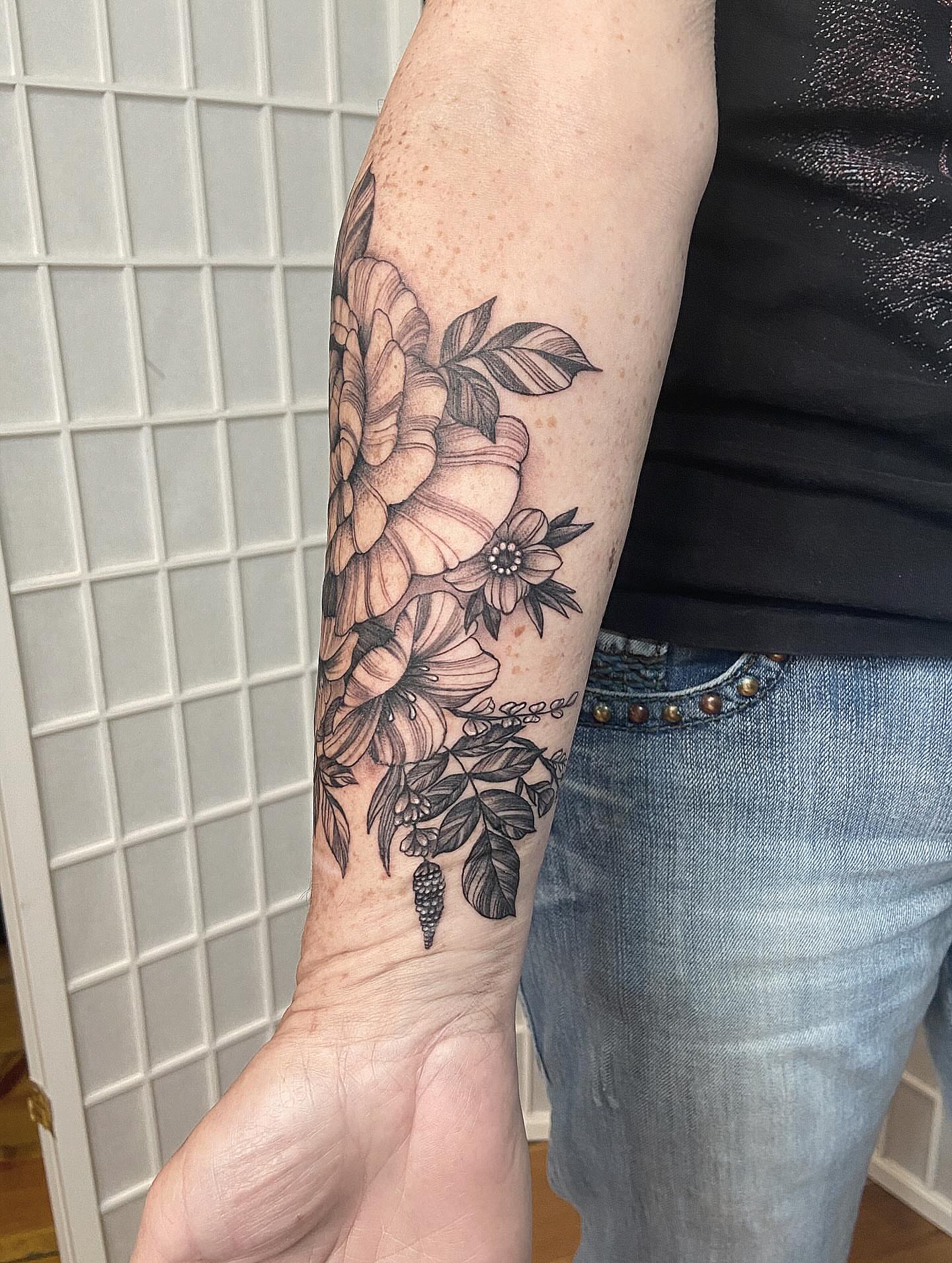 Floral bouquet black and grey tattoo on the forearm by Tattoos by Dale Hupke, Lebanon, Ohio