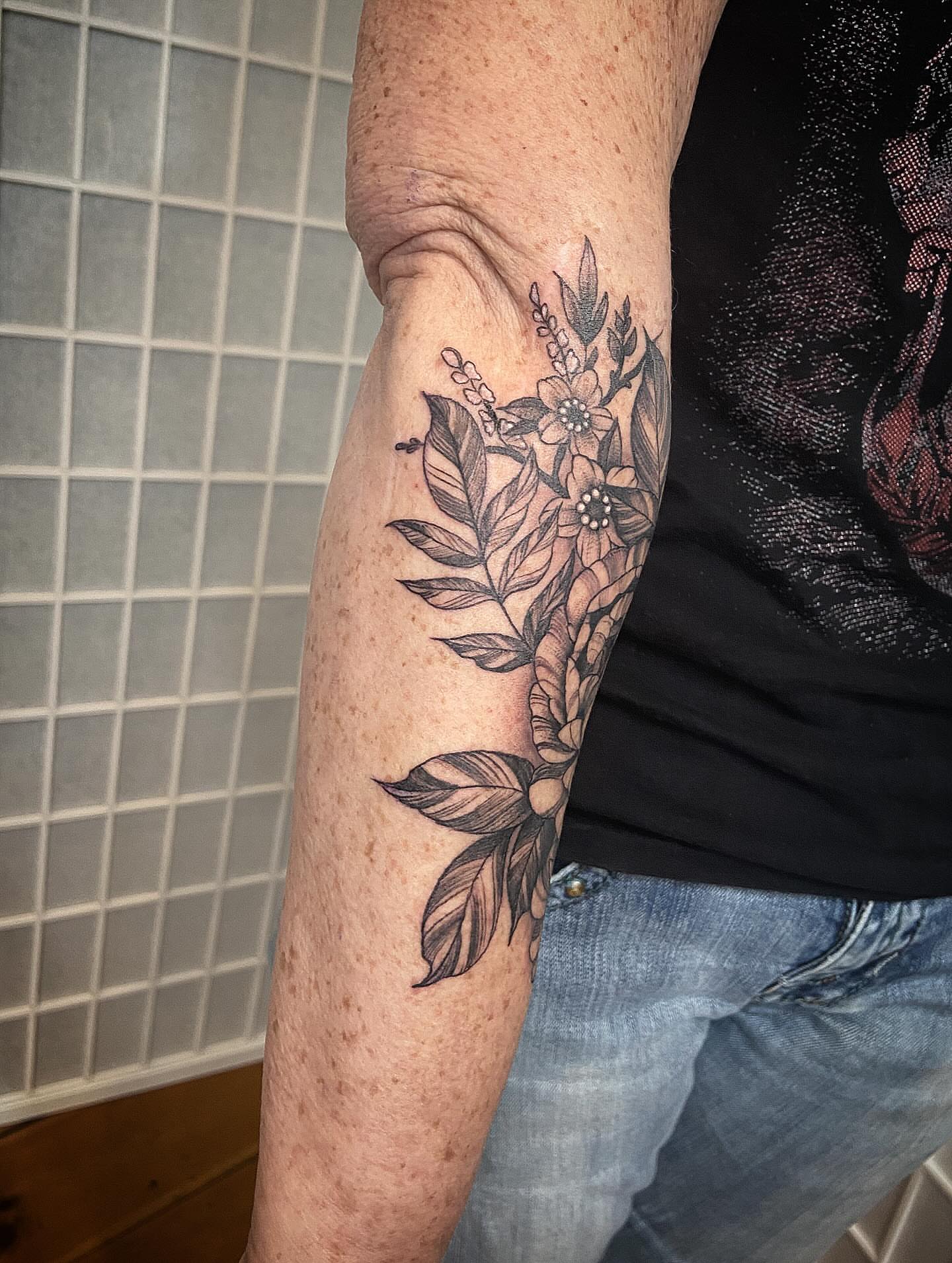 Flower bouquet black and grey tattoo on the forearm by Tattoos by Dale Hupke, Lebanon, Ohio