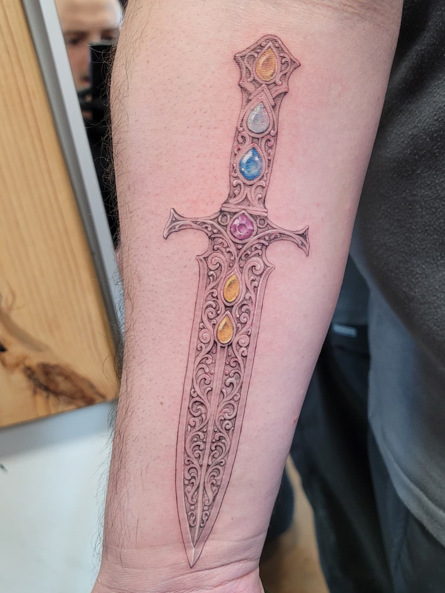 Sword ornamental tattoo on the forearm by Keith Countryman, Fort Worth, Texas
