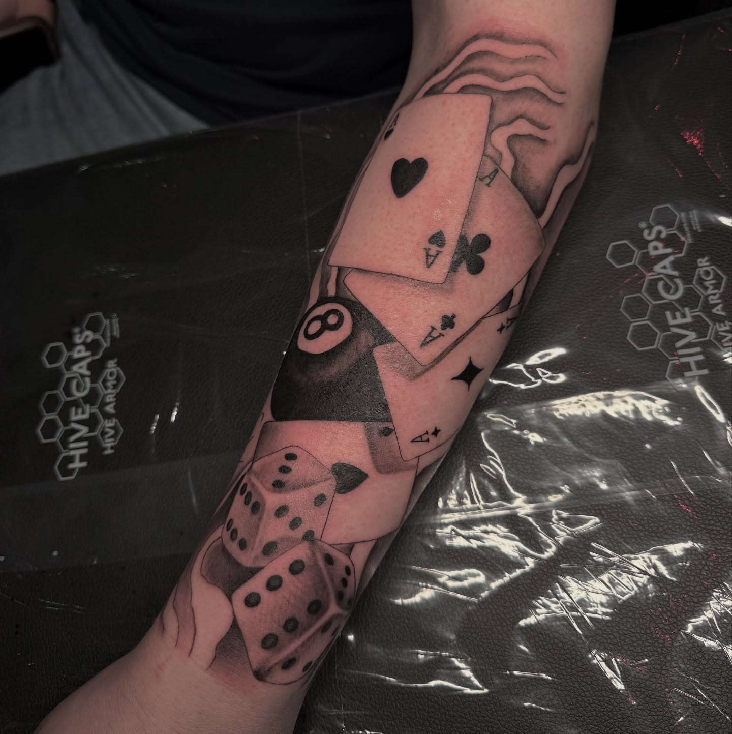Playing cards and dice realism tattoo on the forearm by 𝙰𝚛𝚕𝚒𝚗𝚐𝚝𝚘𝚗 𝚃𝚊𝚝𝚝𝚘𝚘 𝙰𝚛𝚝𝚒𝚜𝚝 ✴︎ 𝚝𝚊𝚝𝚜𝚇𝚟𝚊𝚕