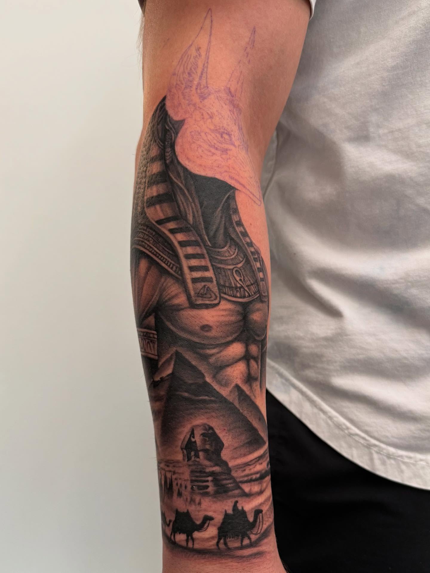 Egyptian god realism tattoo on the forearm by Sam Oakes