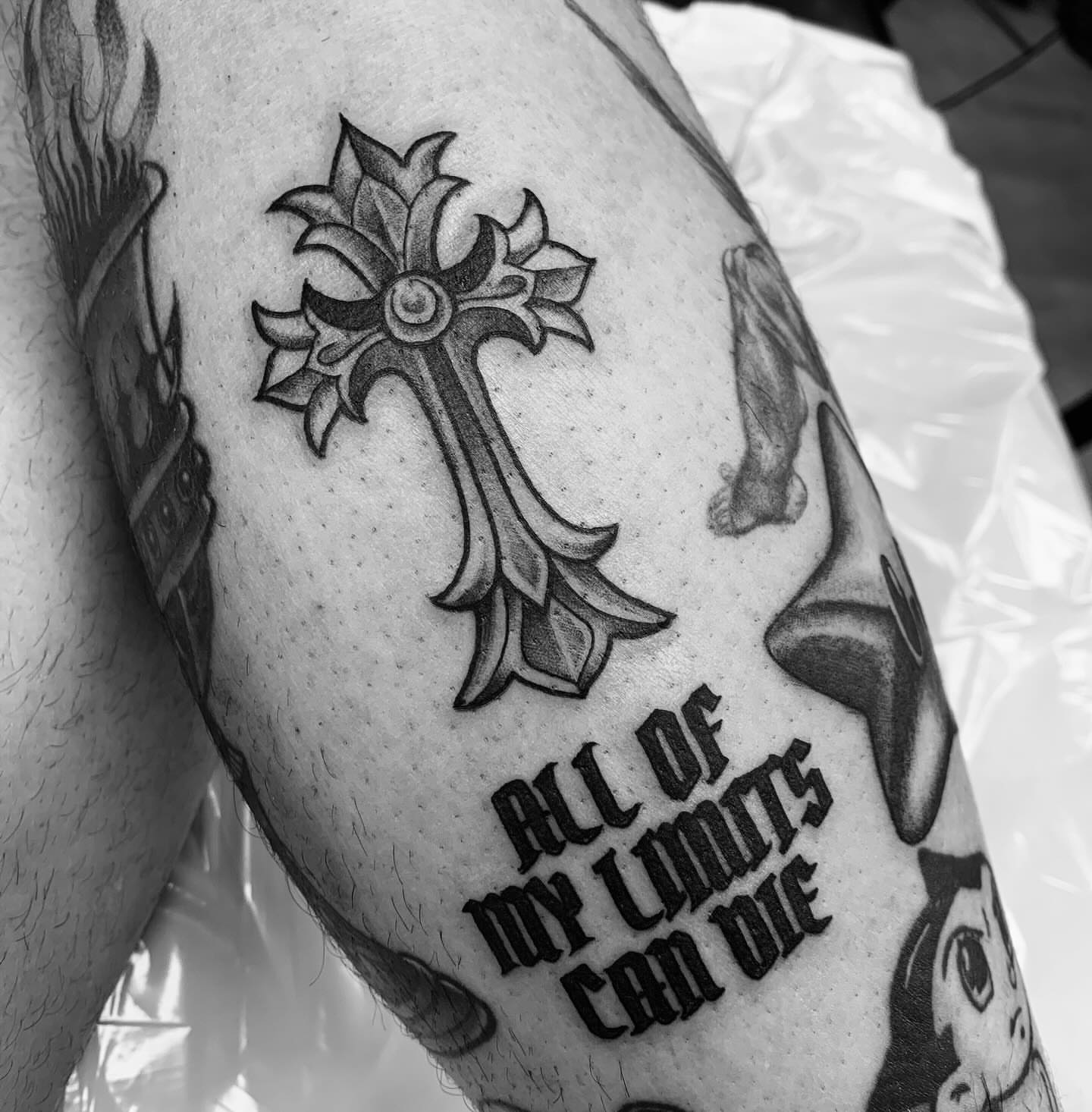 Cross black and grey tattoo on the forearm by Xena