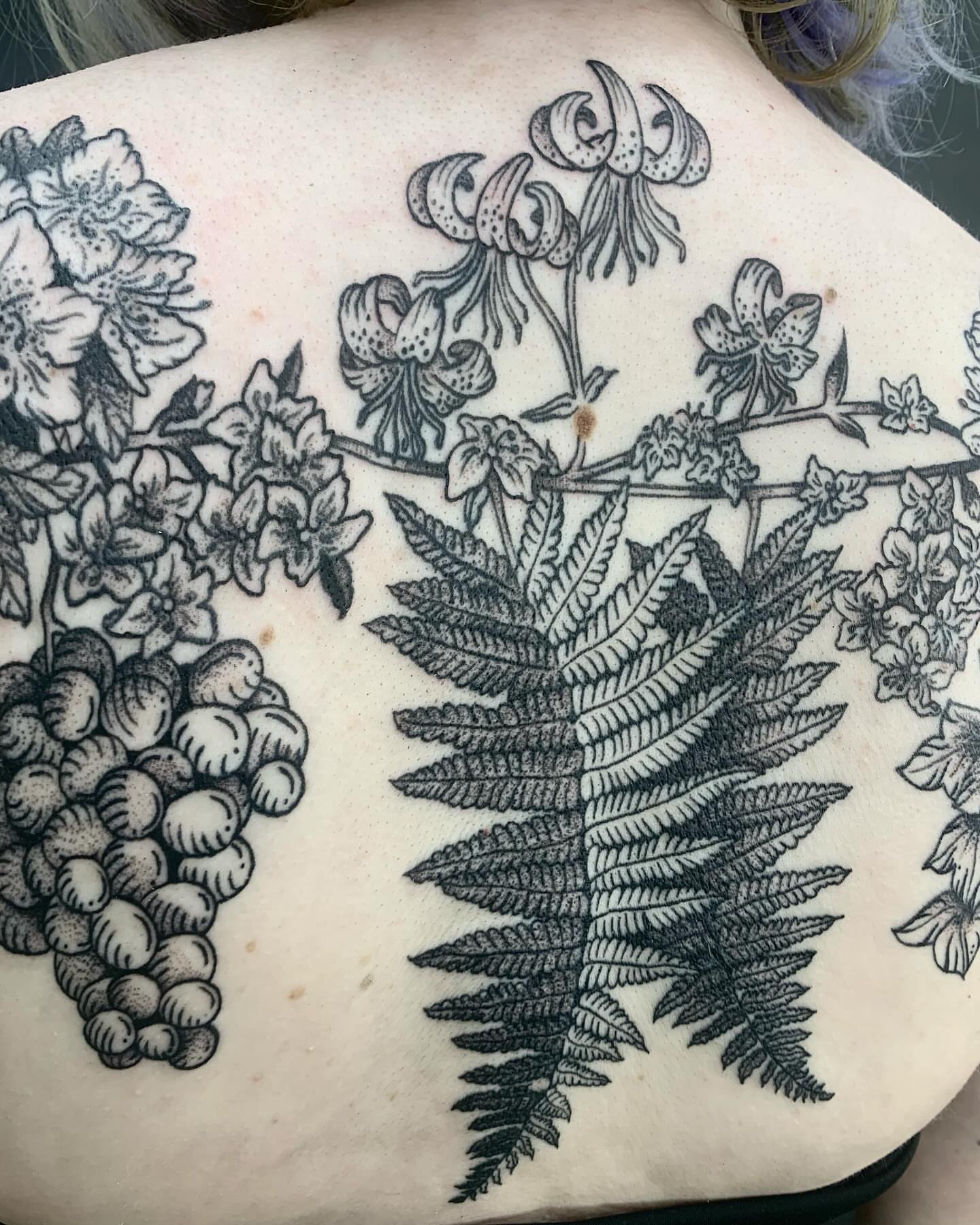 Botanical black and grey tattoo on the back by jay