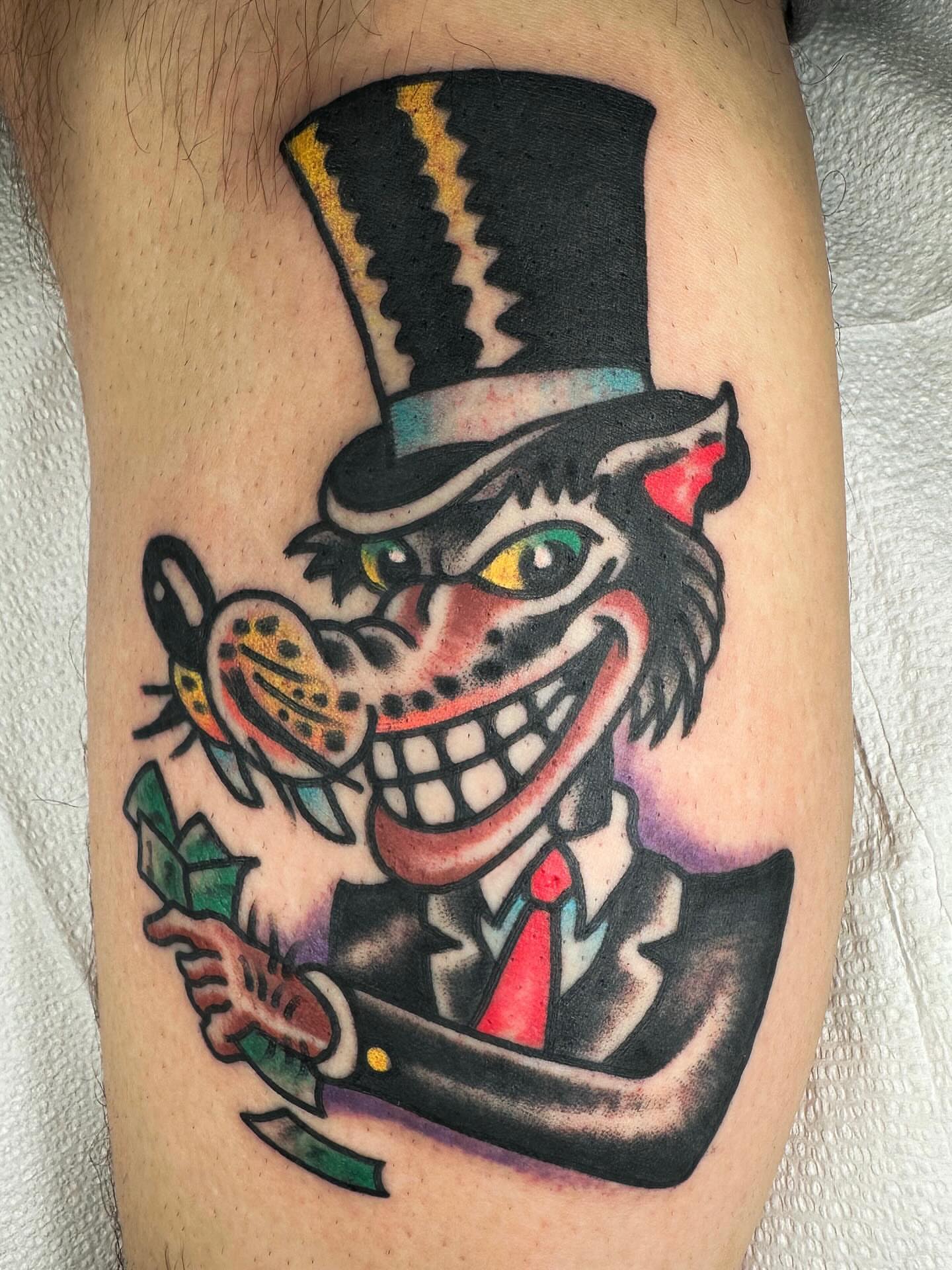 Clown American traditional tattoo on the thigh by David Devaney, Knoxville, Tennessee