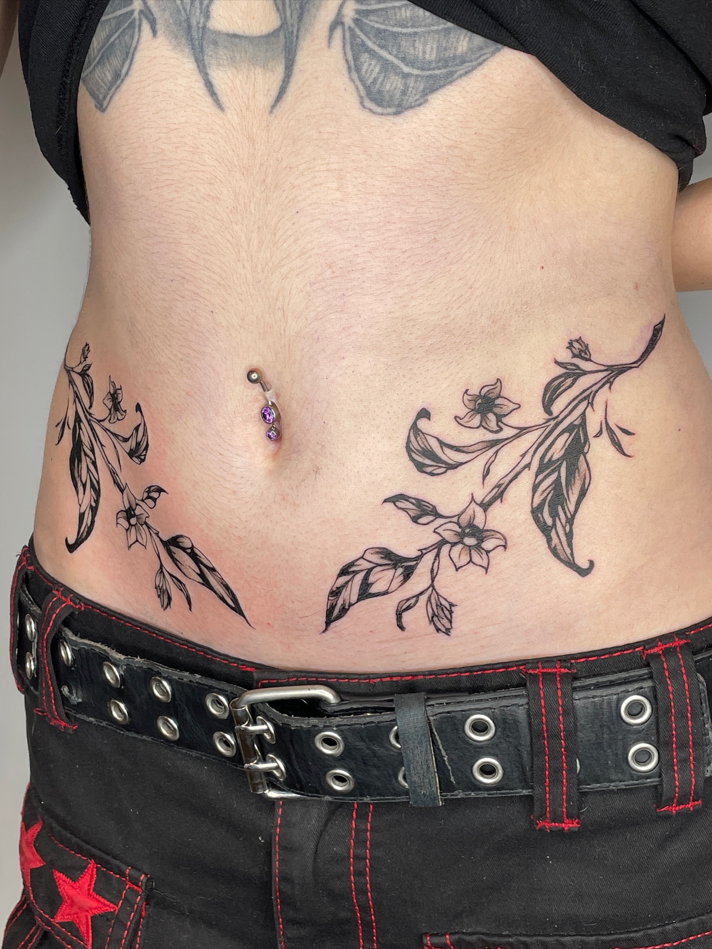 Flower branch black and grey tattoo on the torso by Mia 	\(★ω★)
