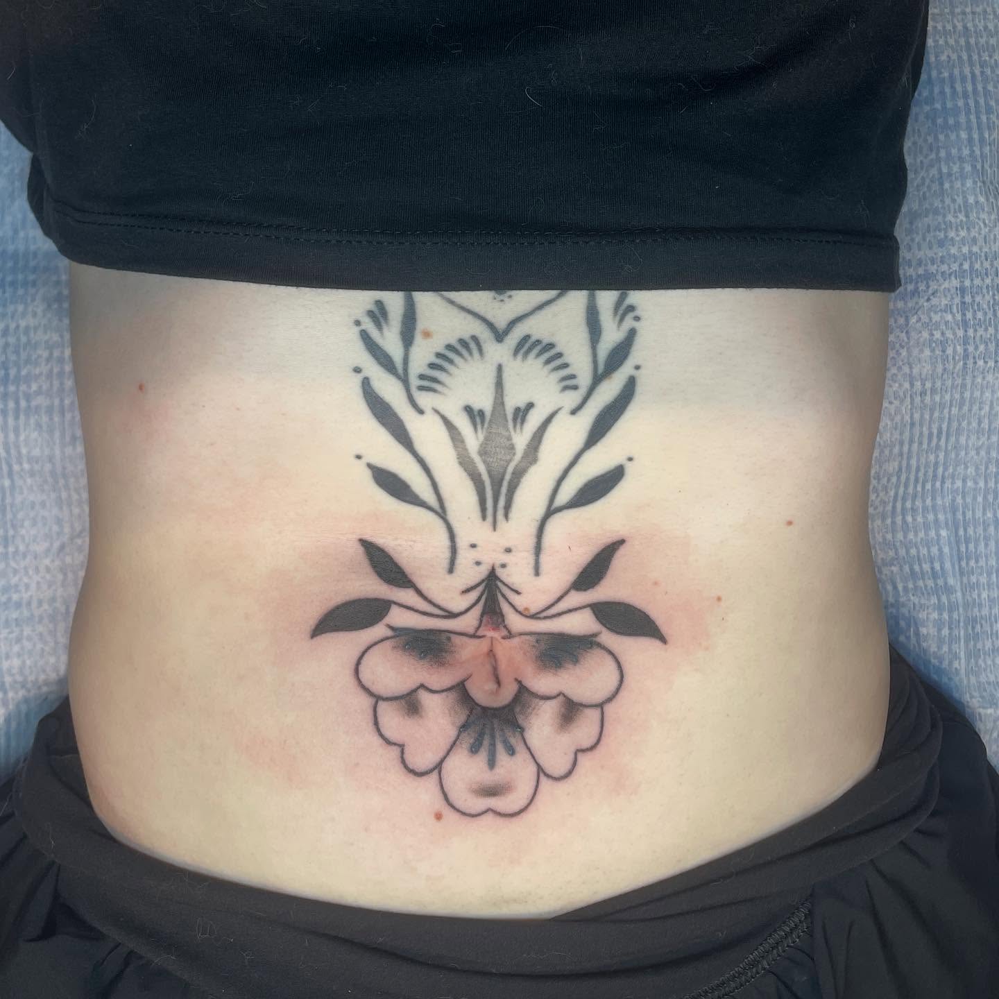 Floral design black and grey tattoo on the torso by 𓉸ྀི lola hoax tattoos𓉸ྀི