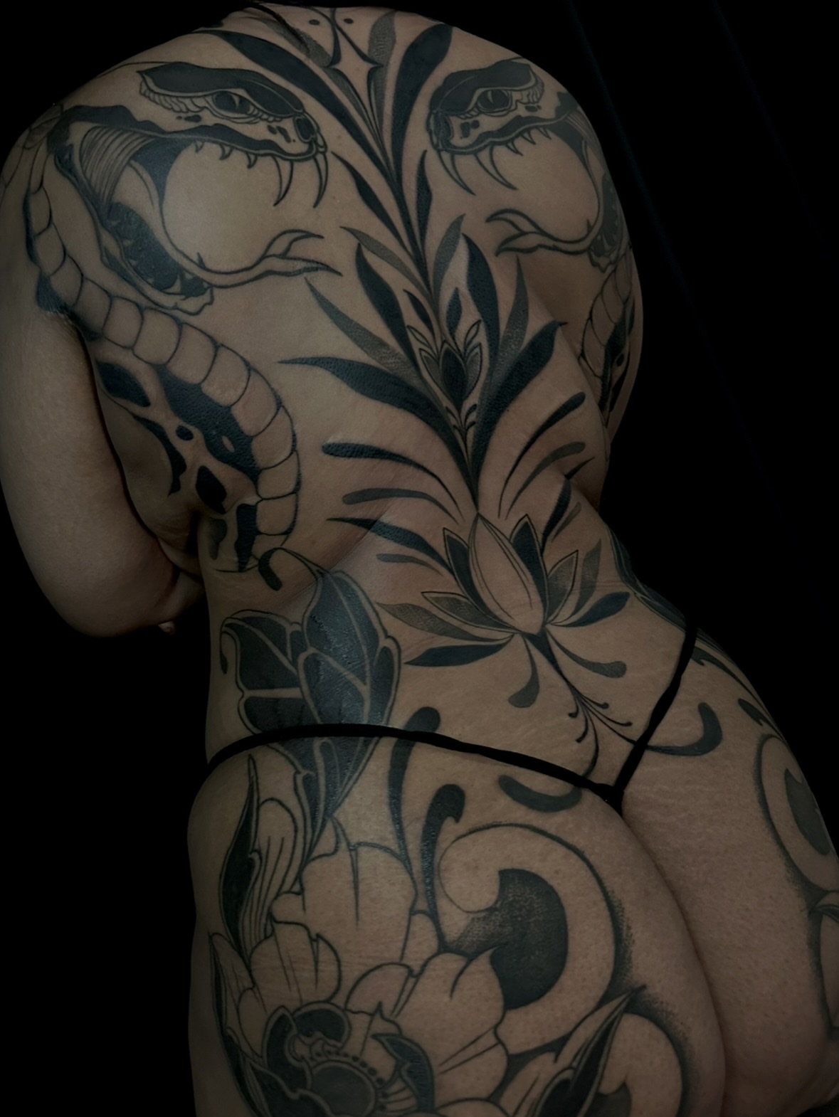 Snake and lotus ornamental tattoo on the back by Crystal, Las Vegas, Nevada