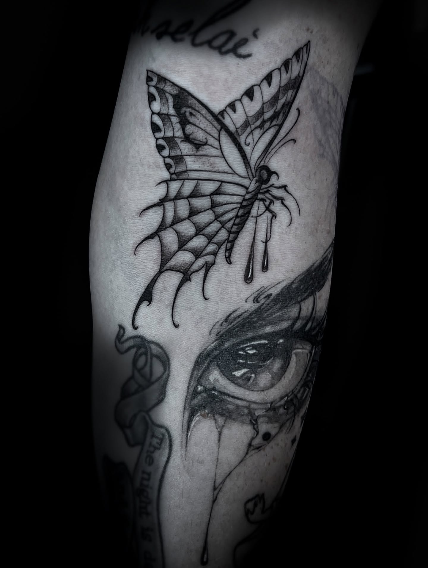 Eye and butterfly realism tattoo on the forearm by Lorenzo Gomez, San Diego, California