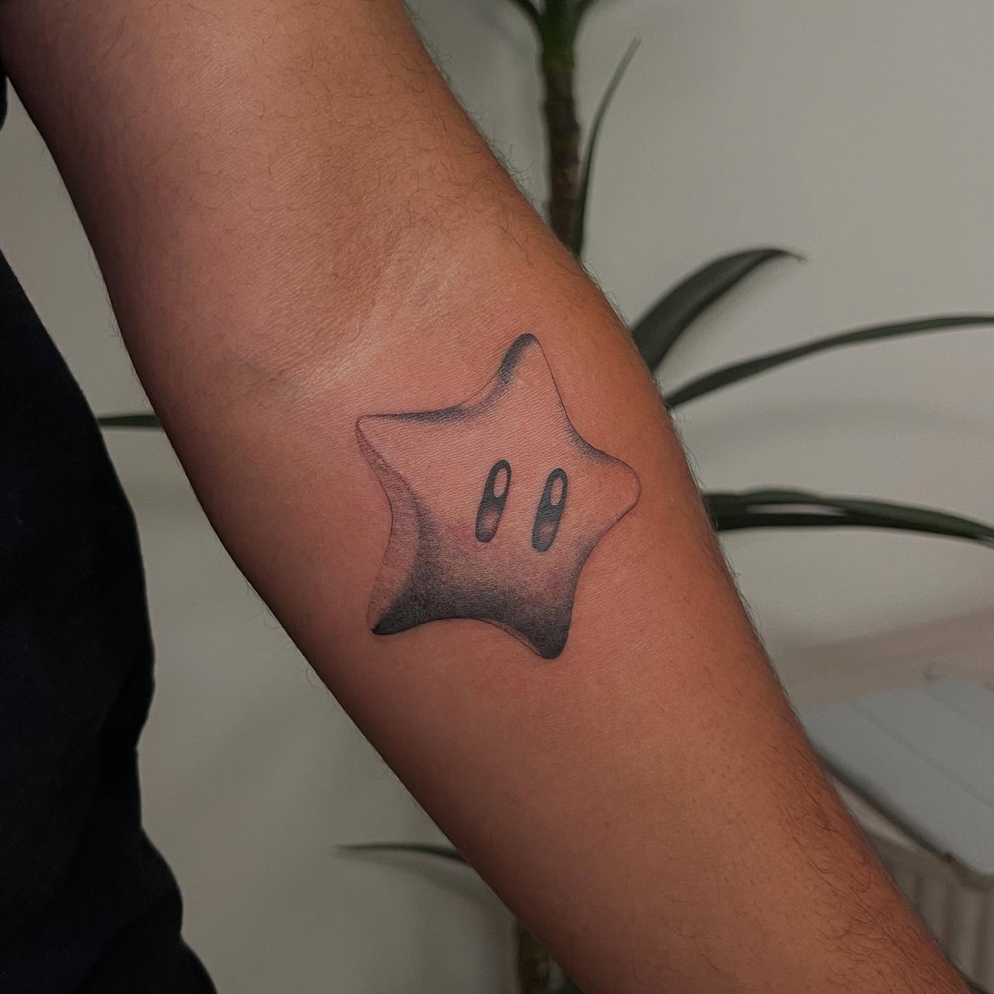 Star black and grey tattoo on the forearm by David