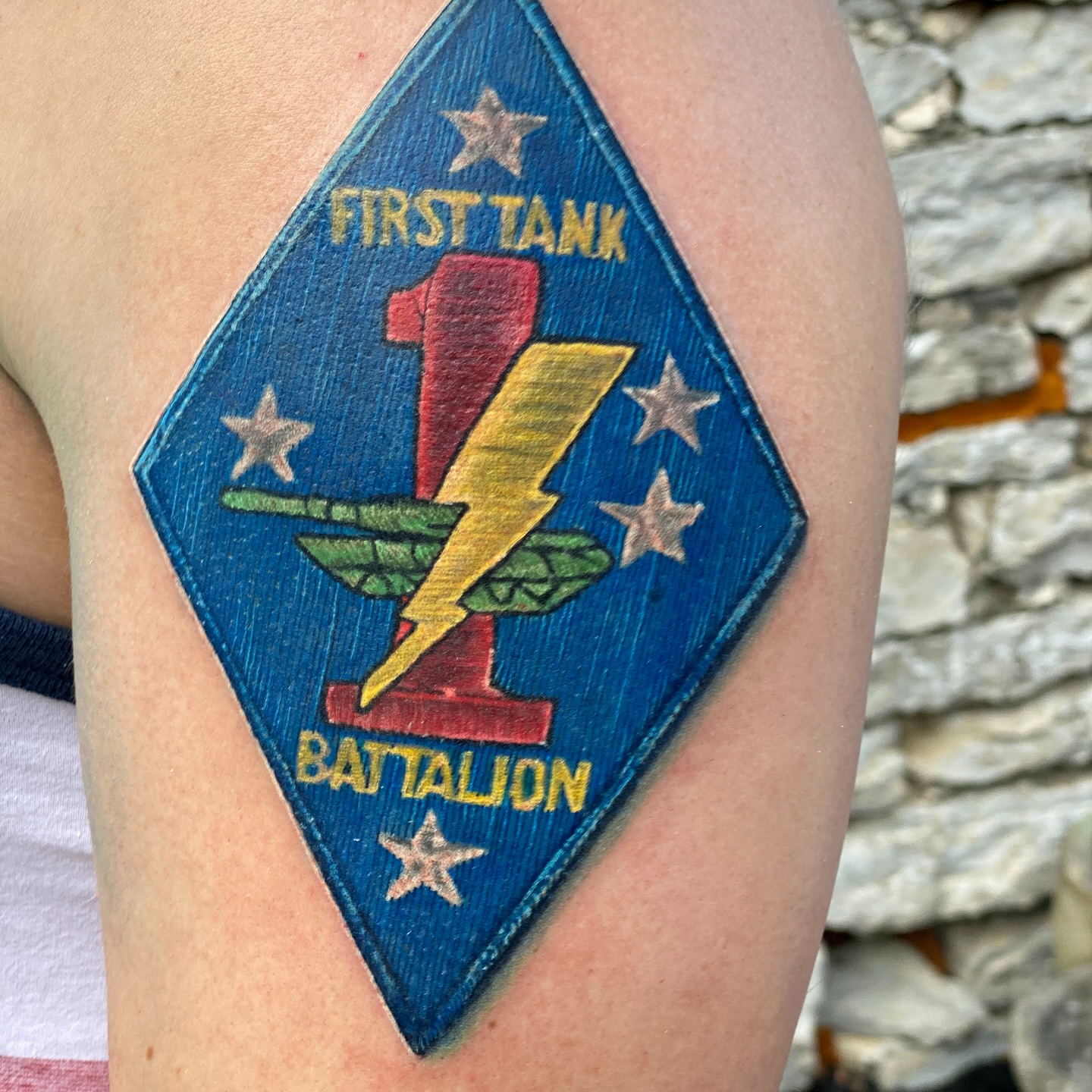 Tank battalion insignia American traditional tattoo on the upper arm by Justin Shelpman