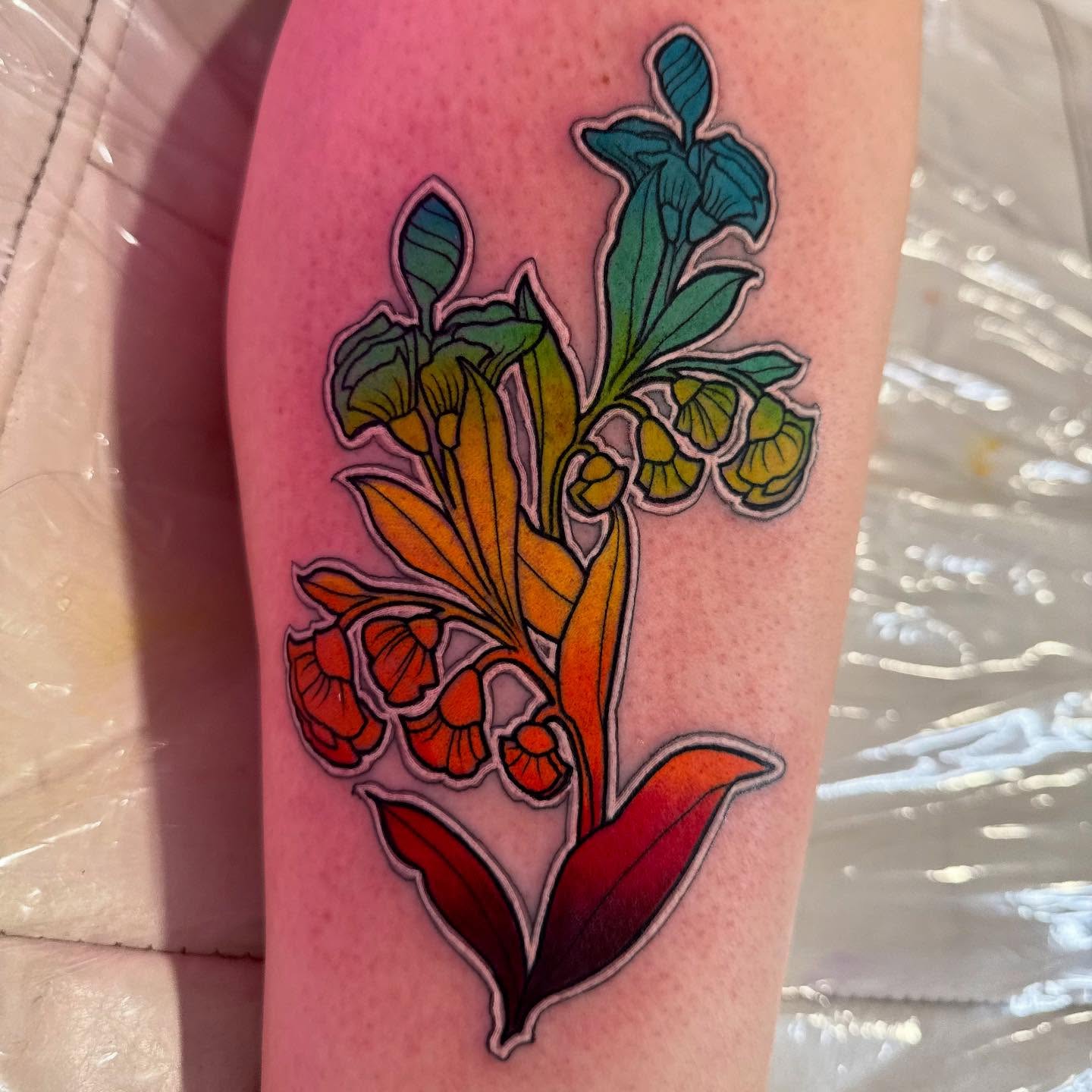 Floral arrangement new school tattoo on the forearm by Michael Latendresse