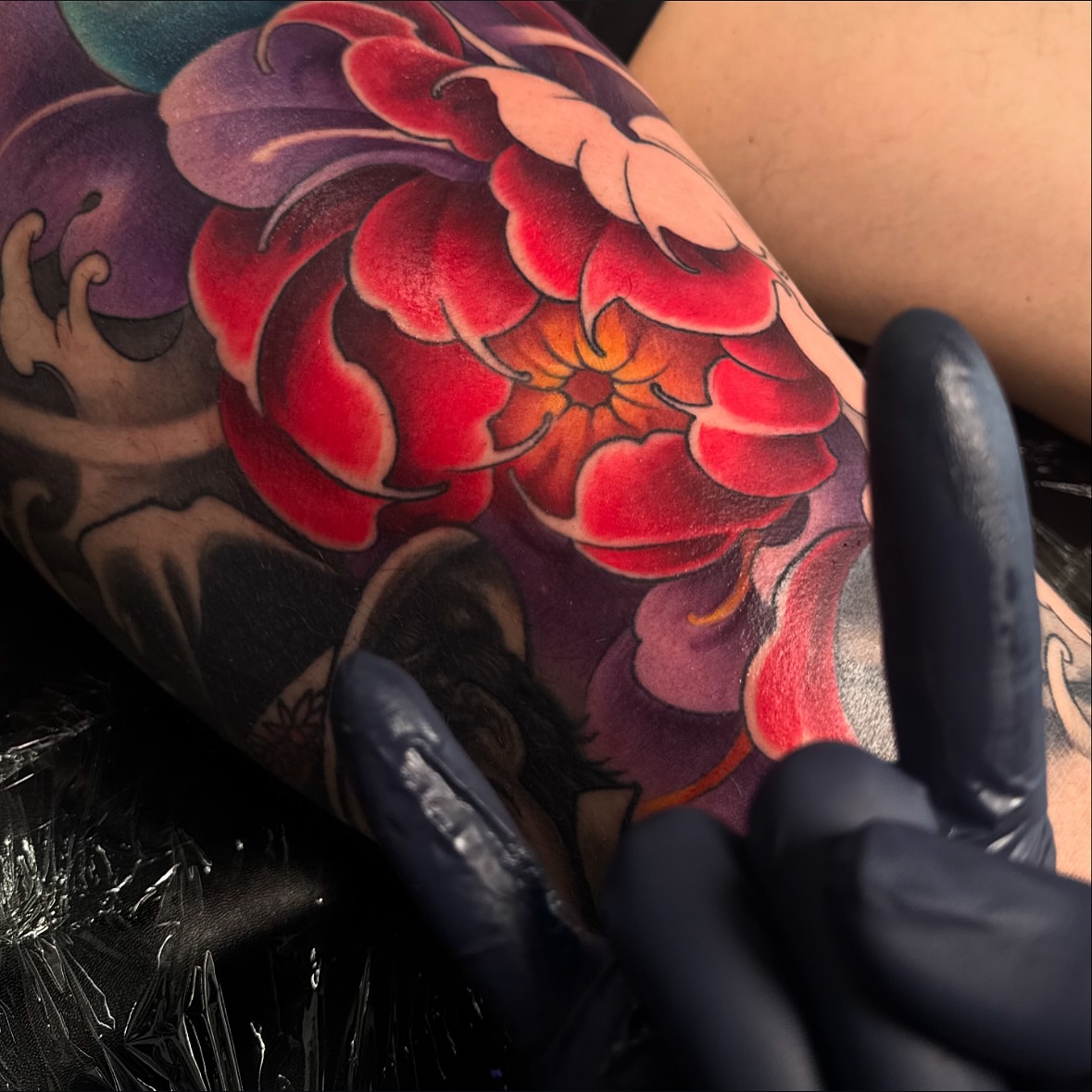 Red flower japanese irezumi tattoo on the forearm by James Hall