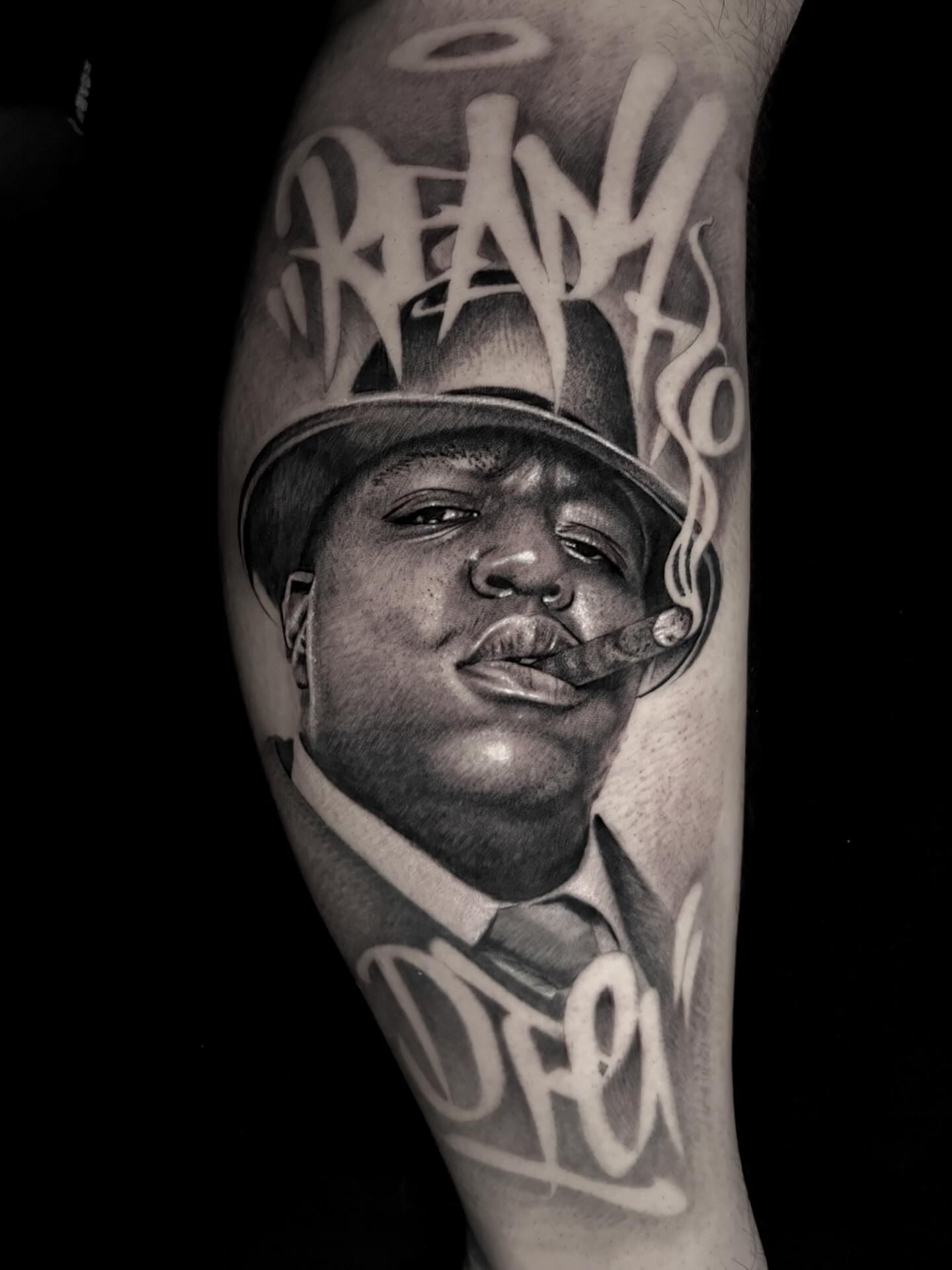 Biggie Smalls portrait realism tattoo on the forearm by Duo