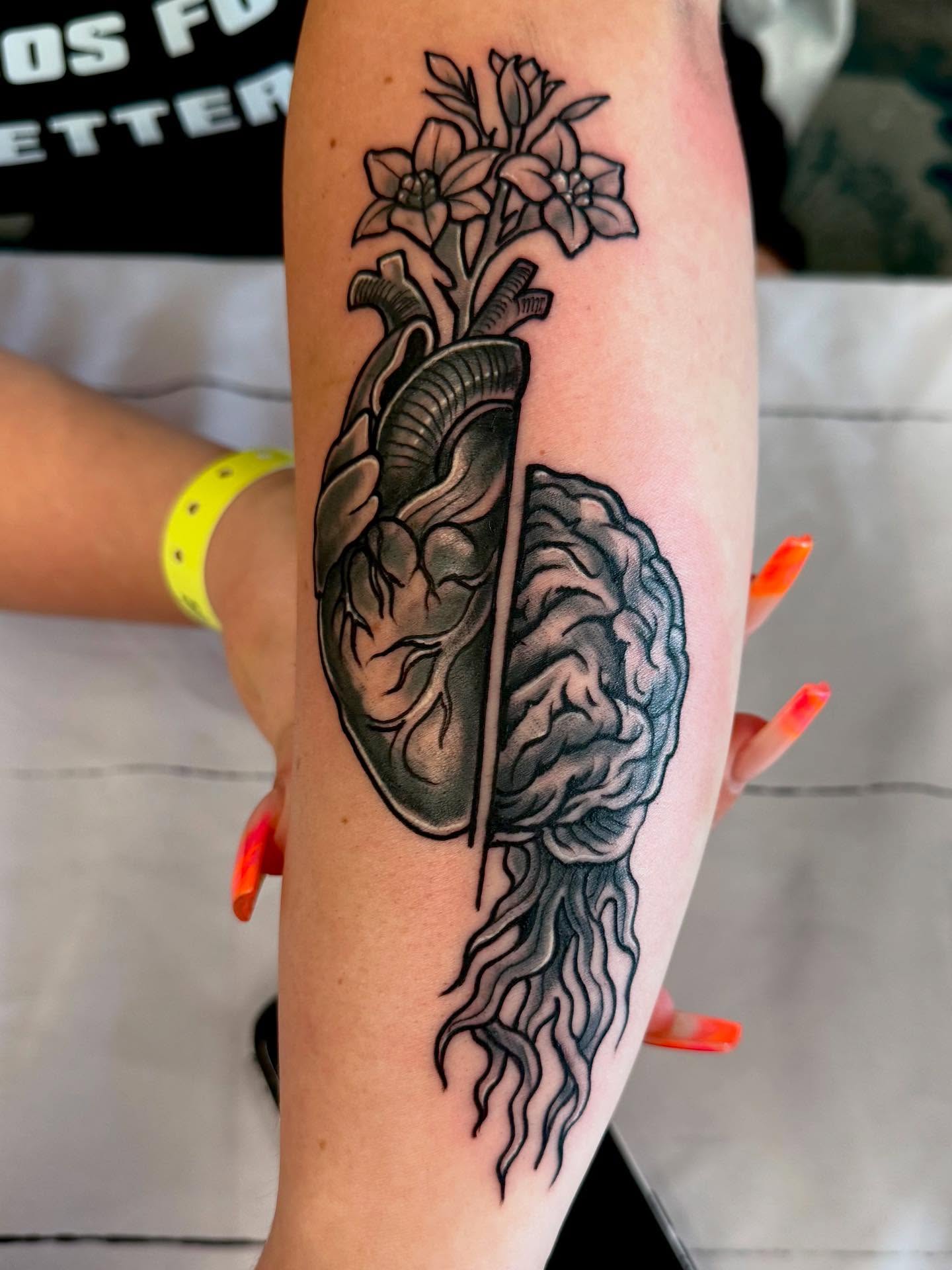 Heart and brain realism tattoo on the forearm by Michael Latendresse