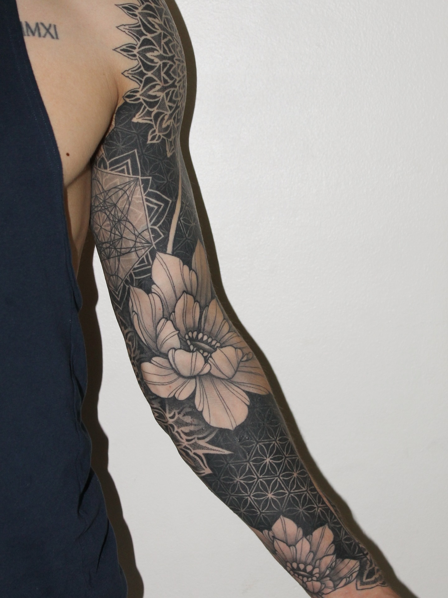 Tattoo by @fleur.tattoos — black_and_grey, geometric