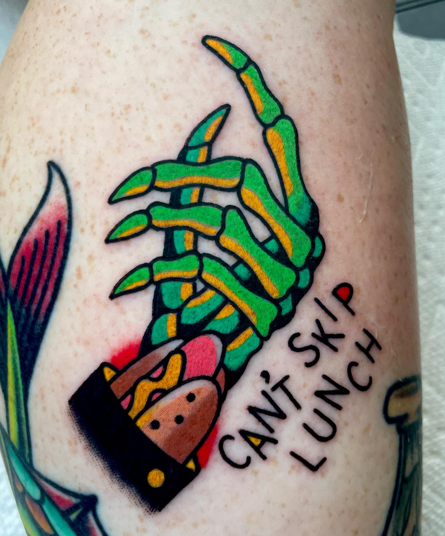 Spine with sandwich American traditional tattoo on the forearm by Ryan McDonald
