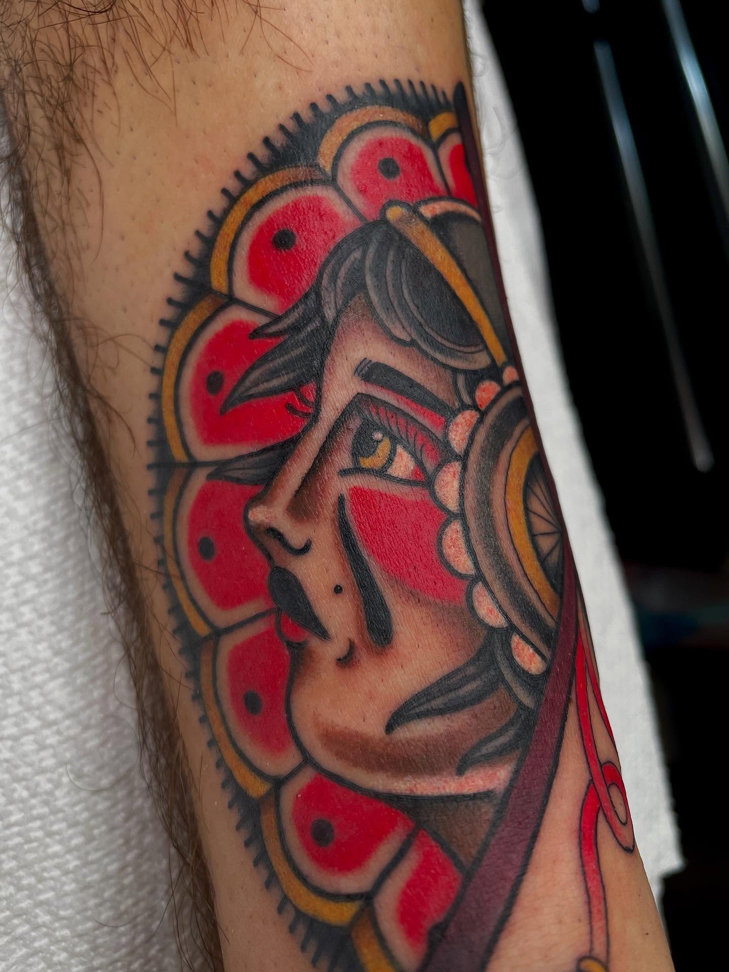 Warrior mask American traditional tattoo on the forearm by Josh Johns
