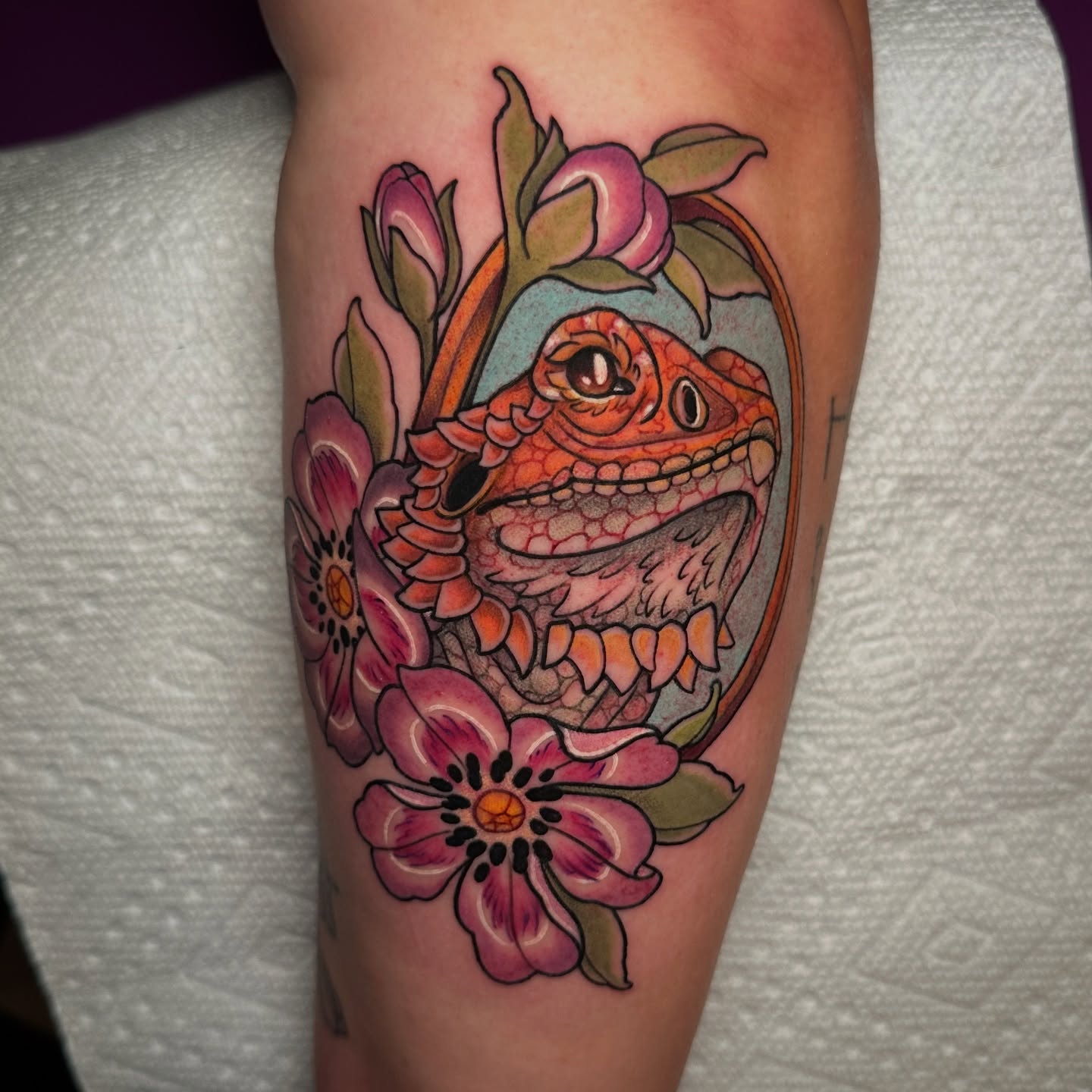 Bearded dragon and flowers American traditional tattoo on the forearm by Tayler Pearson, Fort Collins, Colorado