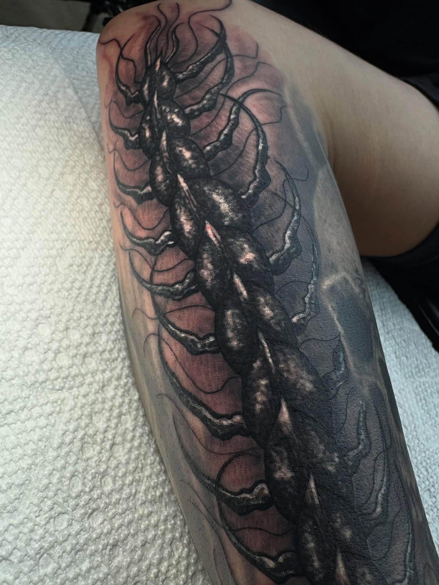 Centipede black and grey tattoo on the forearm by Trusty Dizon Tattoo Artist