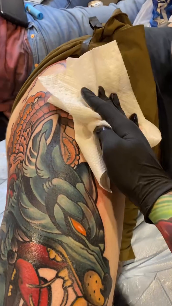 Wolf and octopus tattoo Japanese tattoo on the upper arm by Ian Dorman