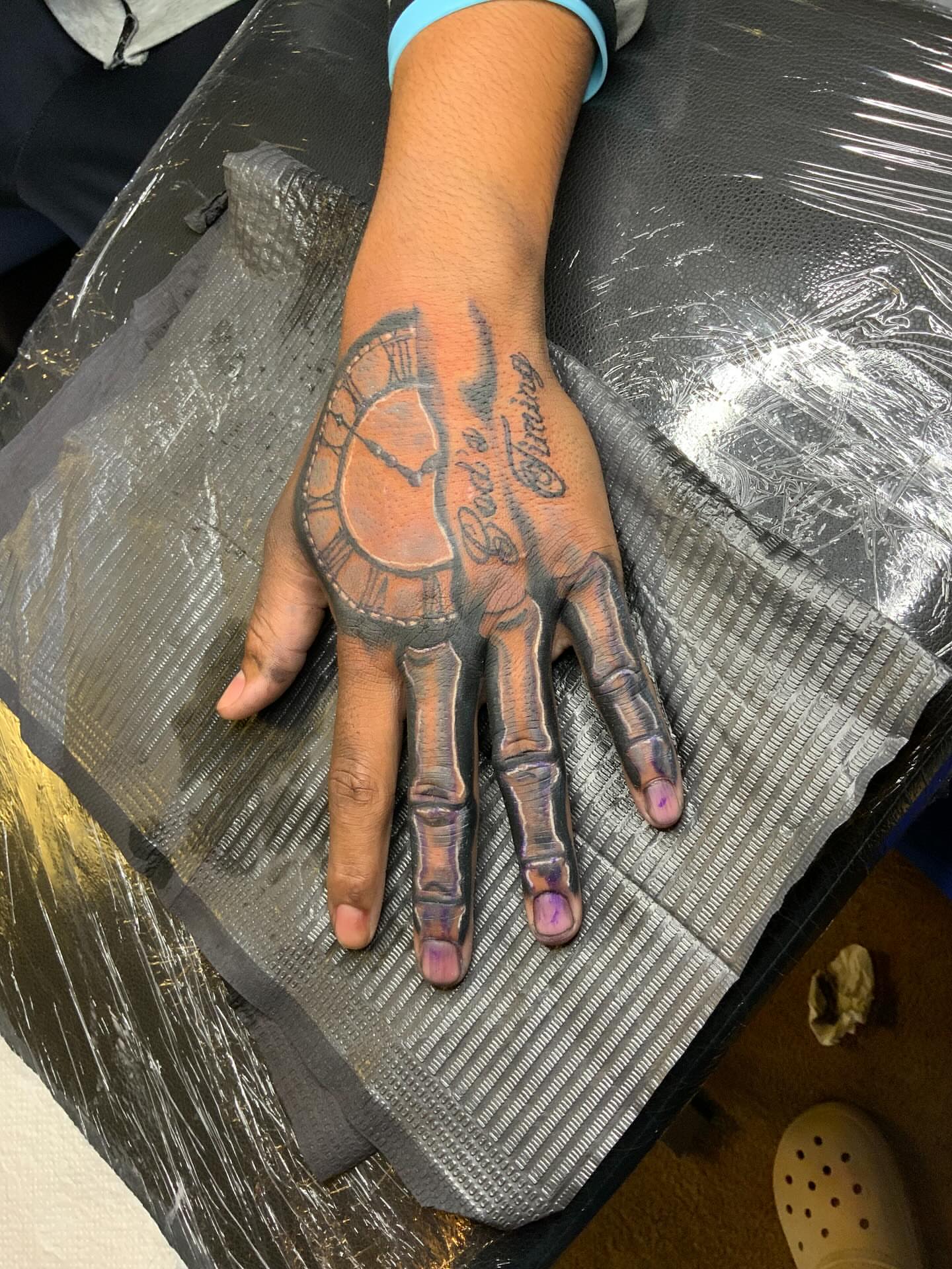 Skeleton hand realism tattoo on the hand by Illuminink.gallery