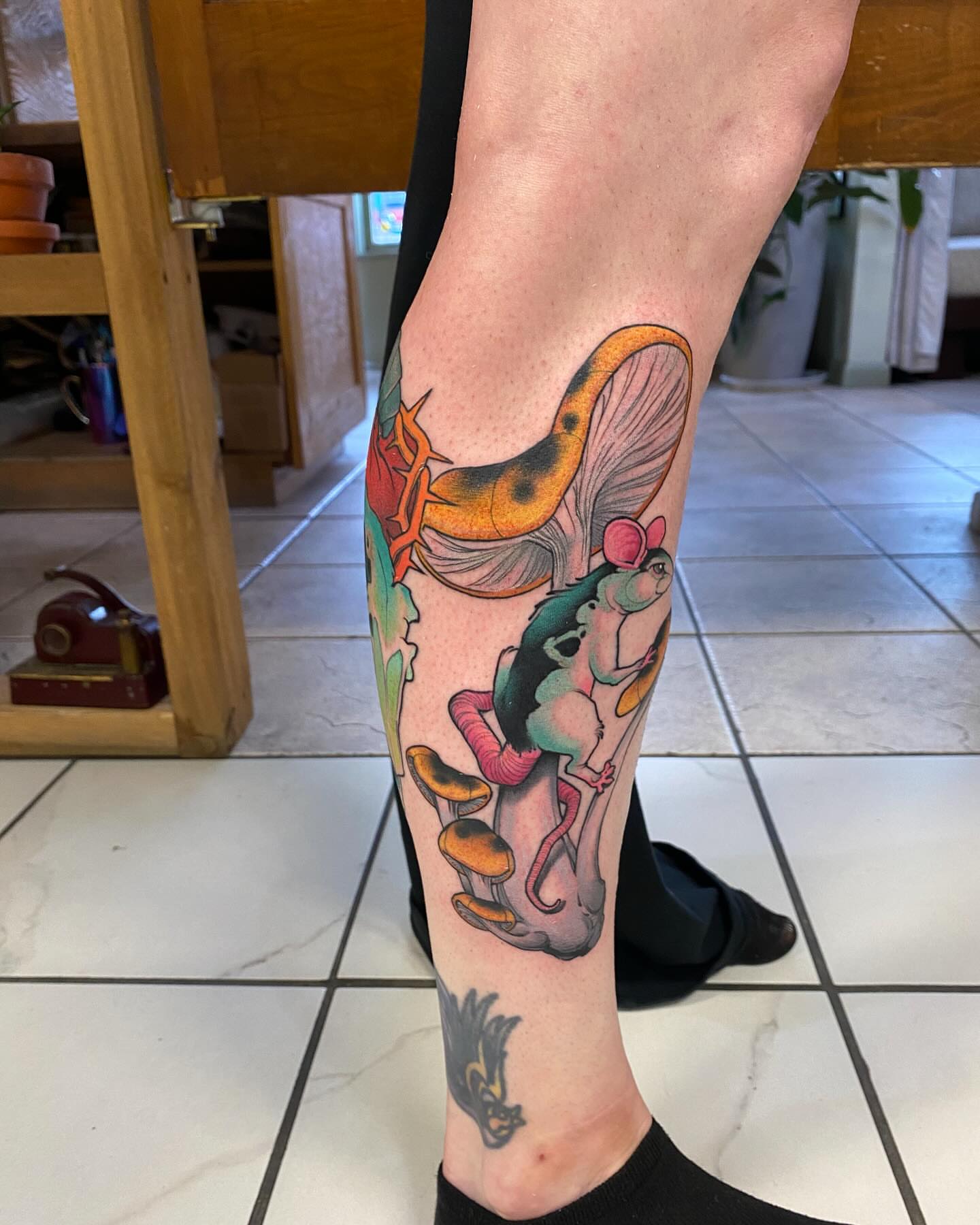 Frog and mushrooms American traditional tattoo on the calf by Kyle Kozek, Columbus, Ohio