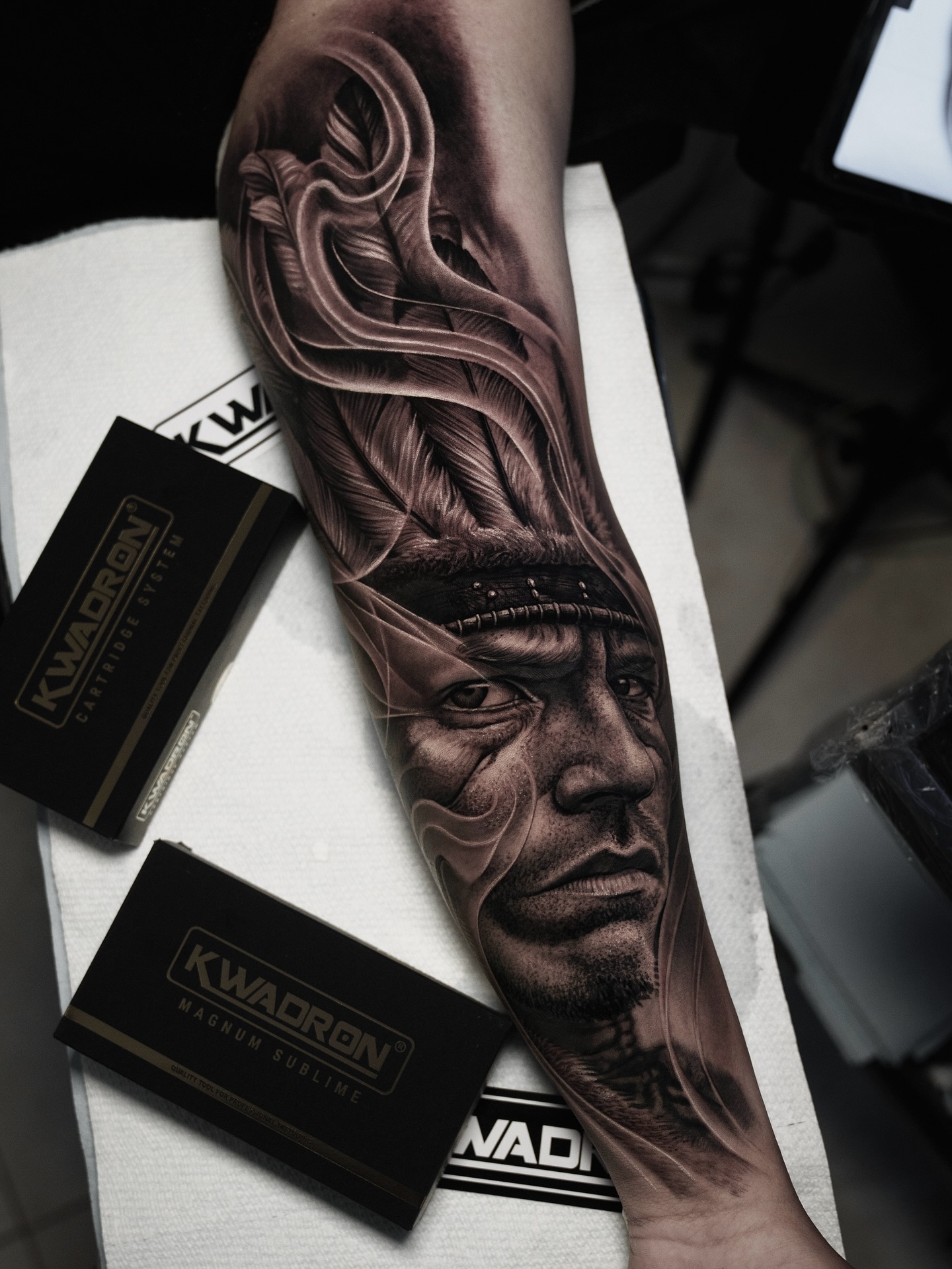 Native American chief portrait with feathers surrealism tattoo on the forearm by @_garart_