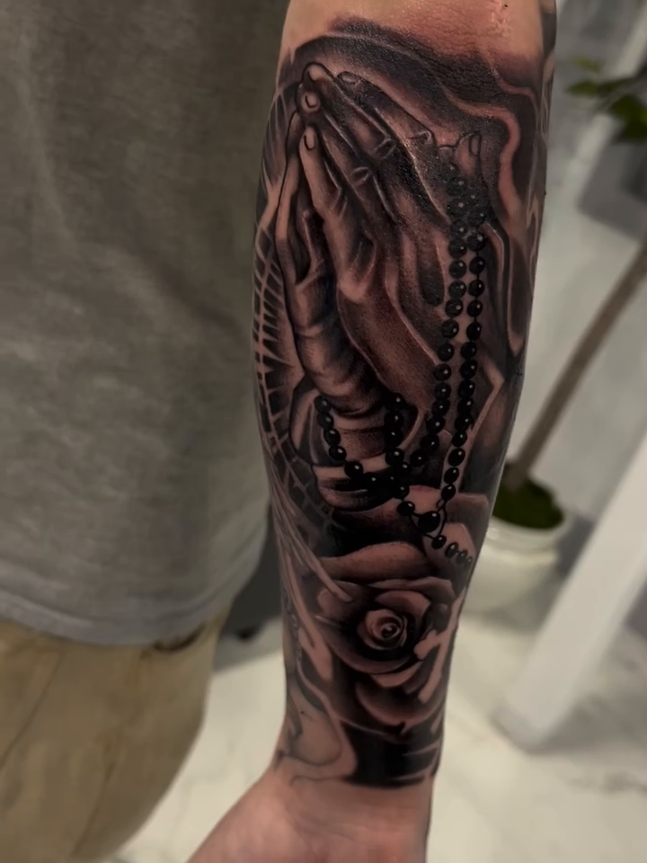 Praying hands with rosary and rose realism tattoo by Jaylen - Atlanta Tattoo Artist