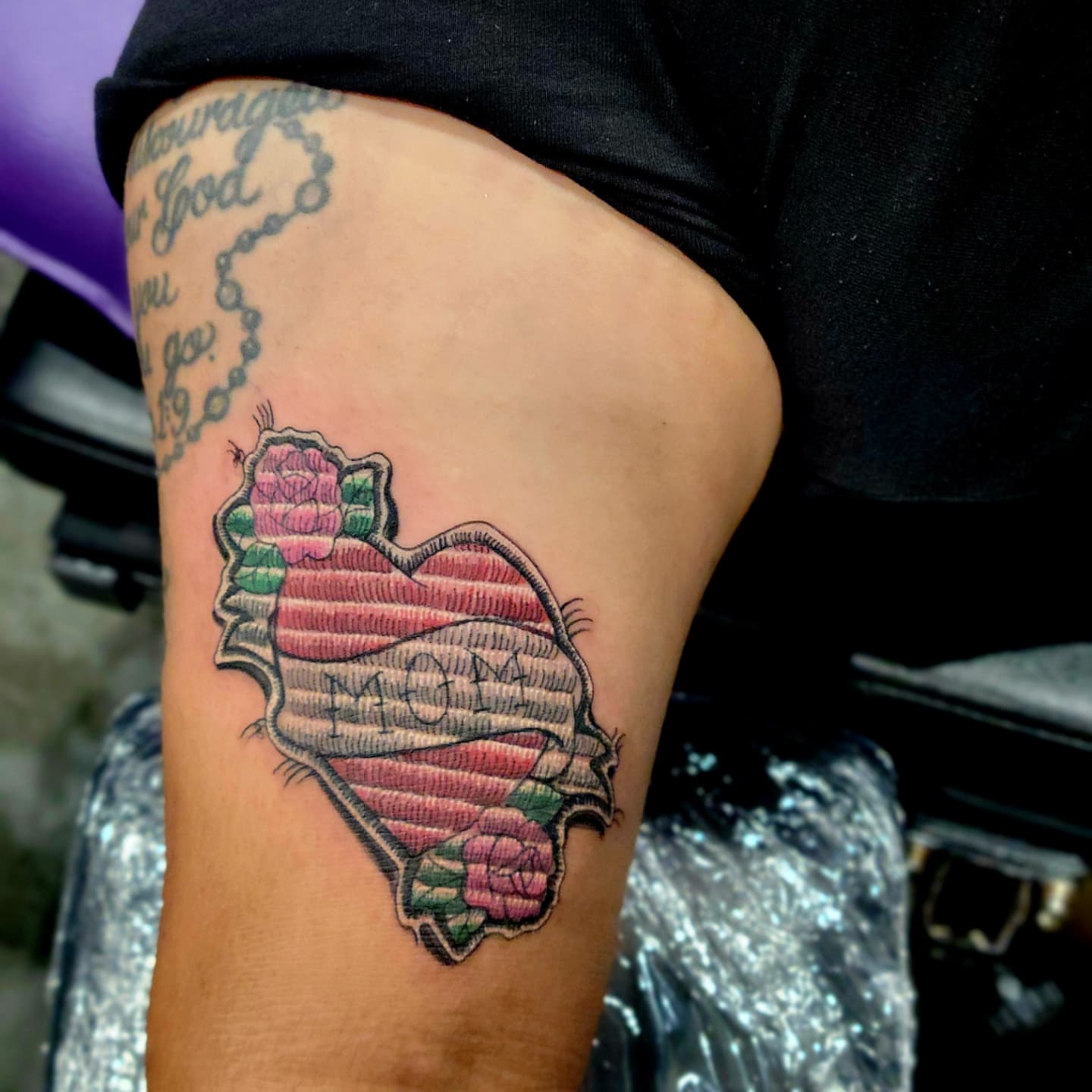 Heart with roses American traditional tattoo on the thigh by Naez Ink AKA Renae Madison, Macomb, Illinois