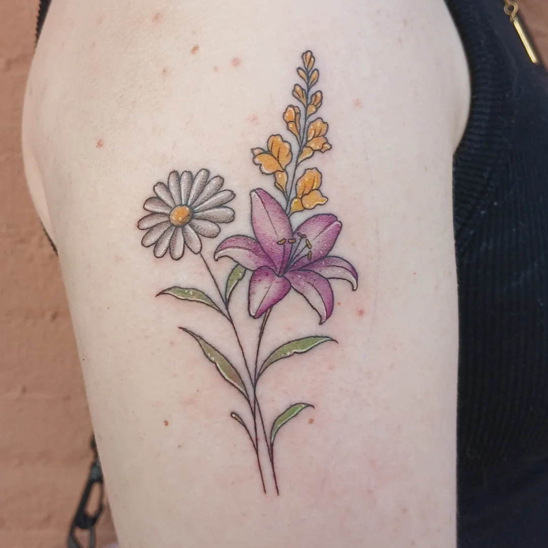 Lily and daisy dotwork tattoo on the thigh by Cassieal Welch