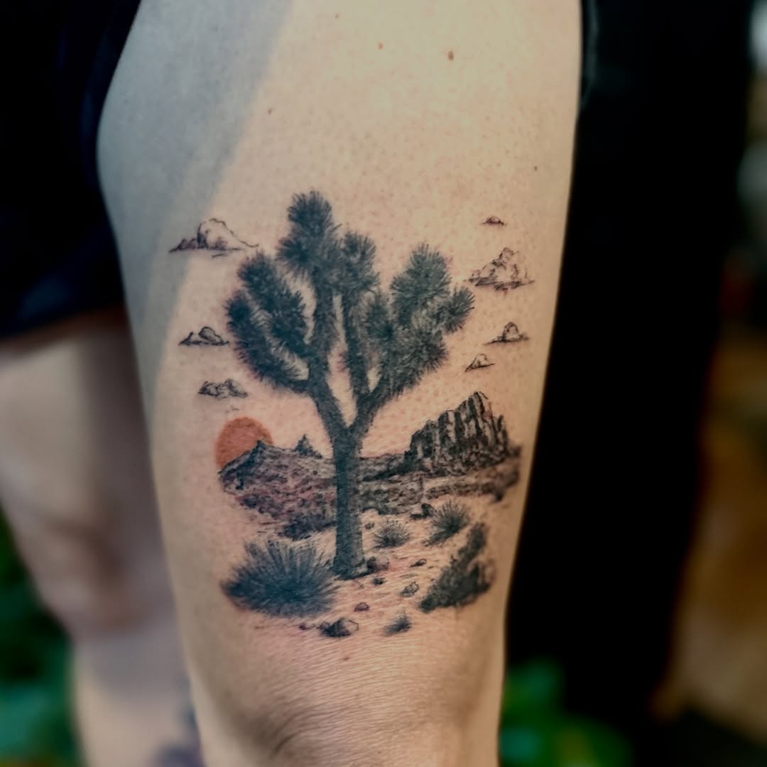 Desert landscape with joshua tree fine line tattoo on the forearm by Tim Andrews