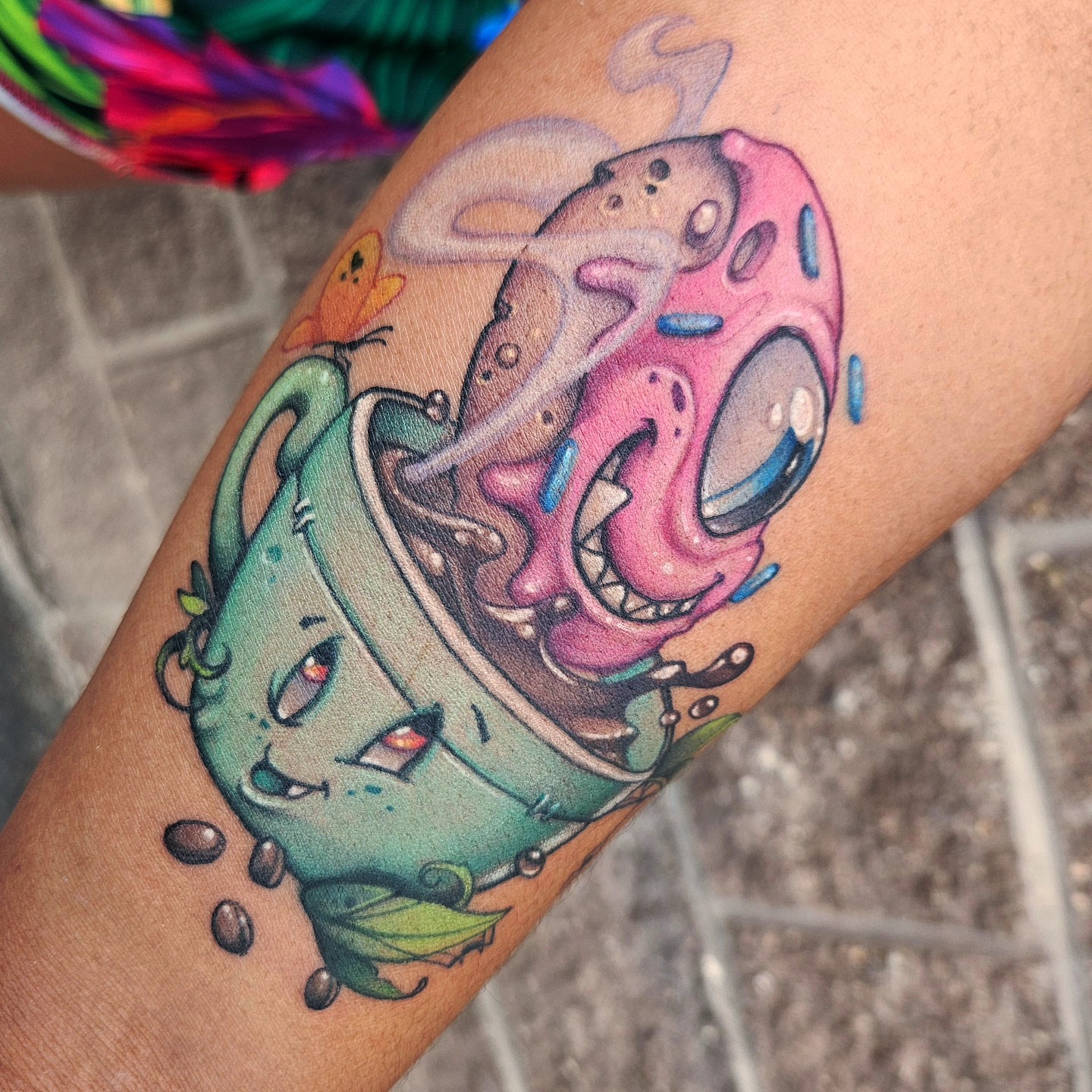 Coffee cup and donut new school tattoo on the forearm by Angell Tattoo Artist, Denver, Colorado