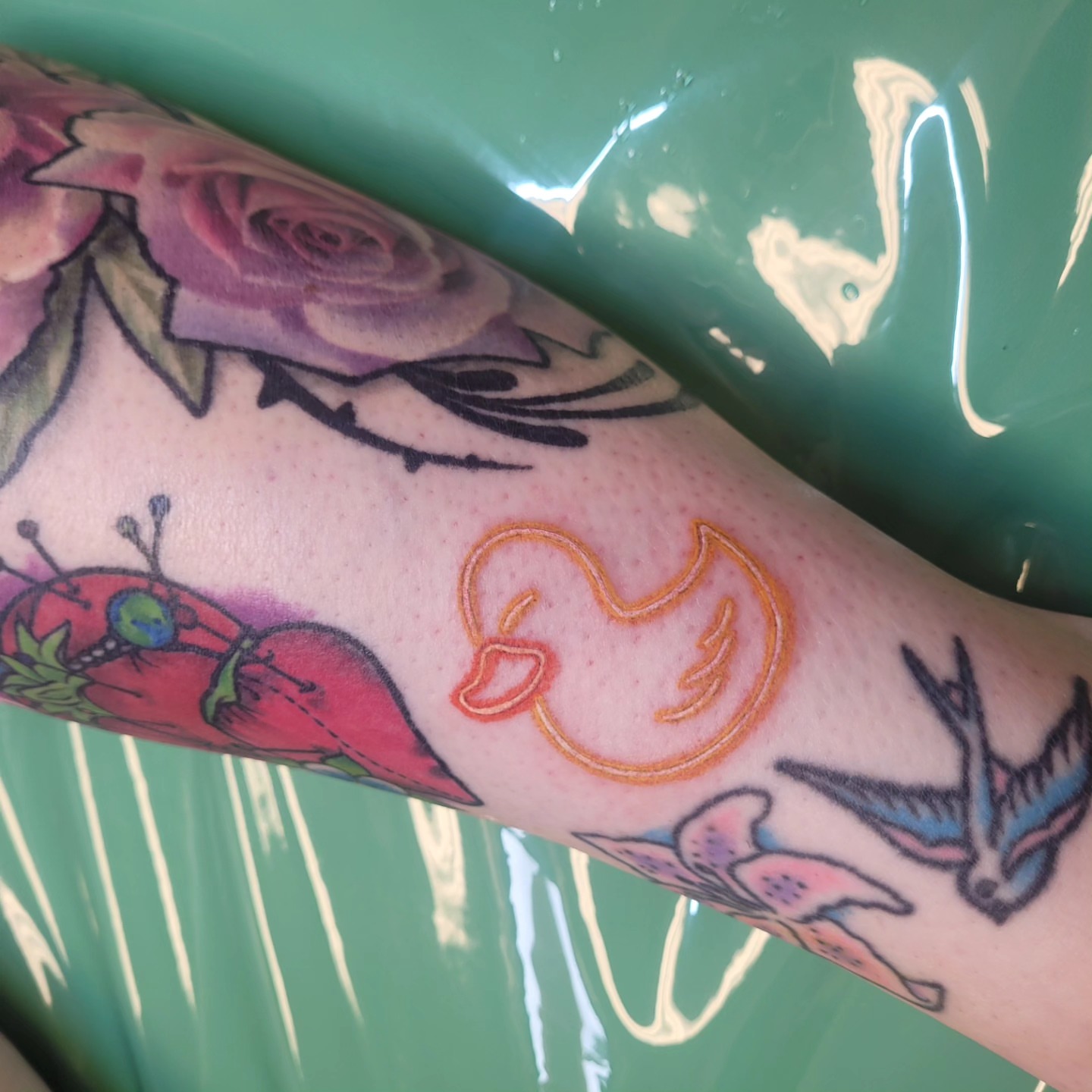 Flame American traditional tattoo on the forearm by Wray Saulsberry