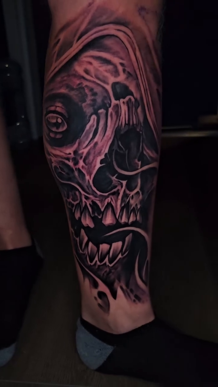 Skull with hood dark realism tattoo by Christian Mulvey