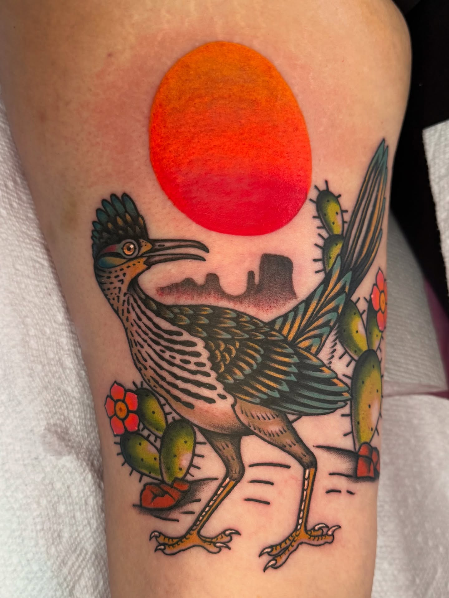 Roadrunner and cactus American traditional tattoo on the forearm by Lisa Del Toro
