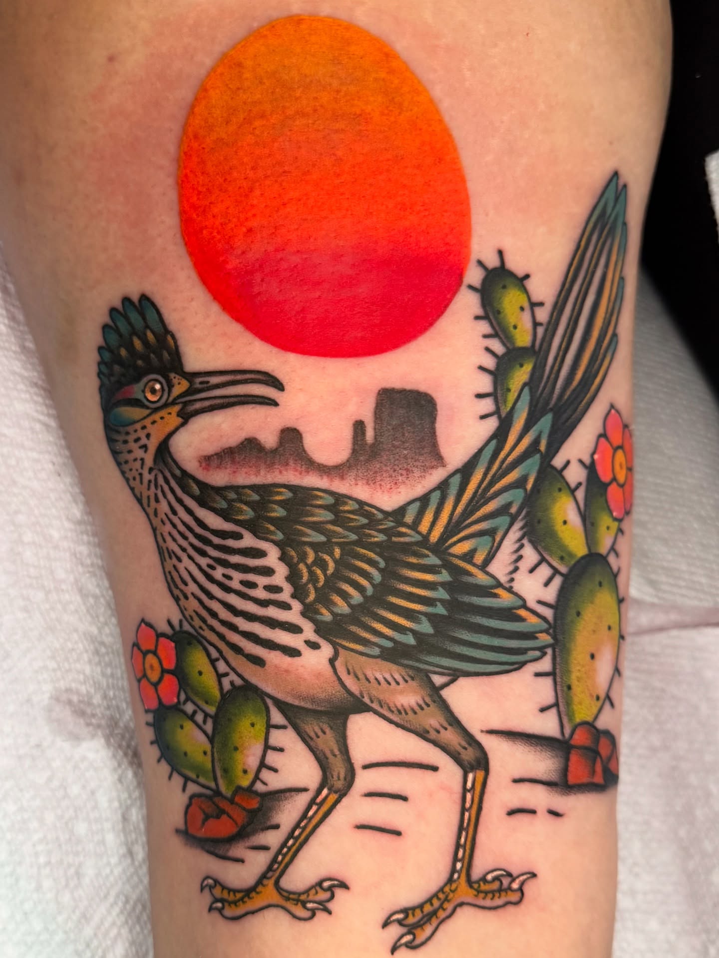 Roadrunner and cactus American traditional tattoo on the forearm by Lisa Del Toro