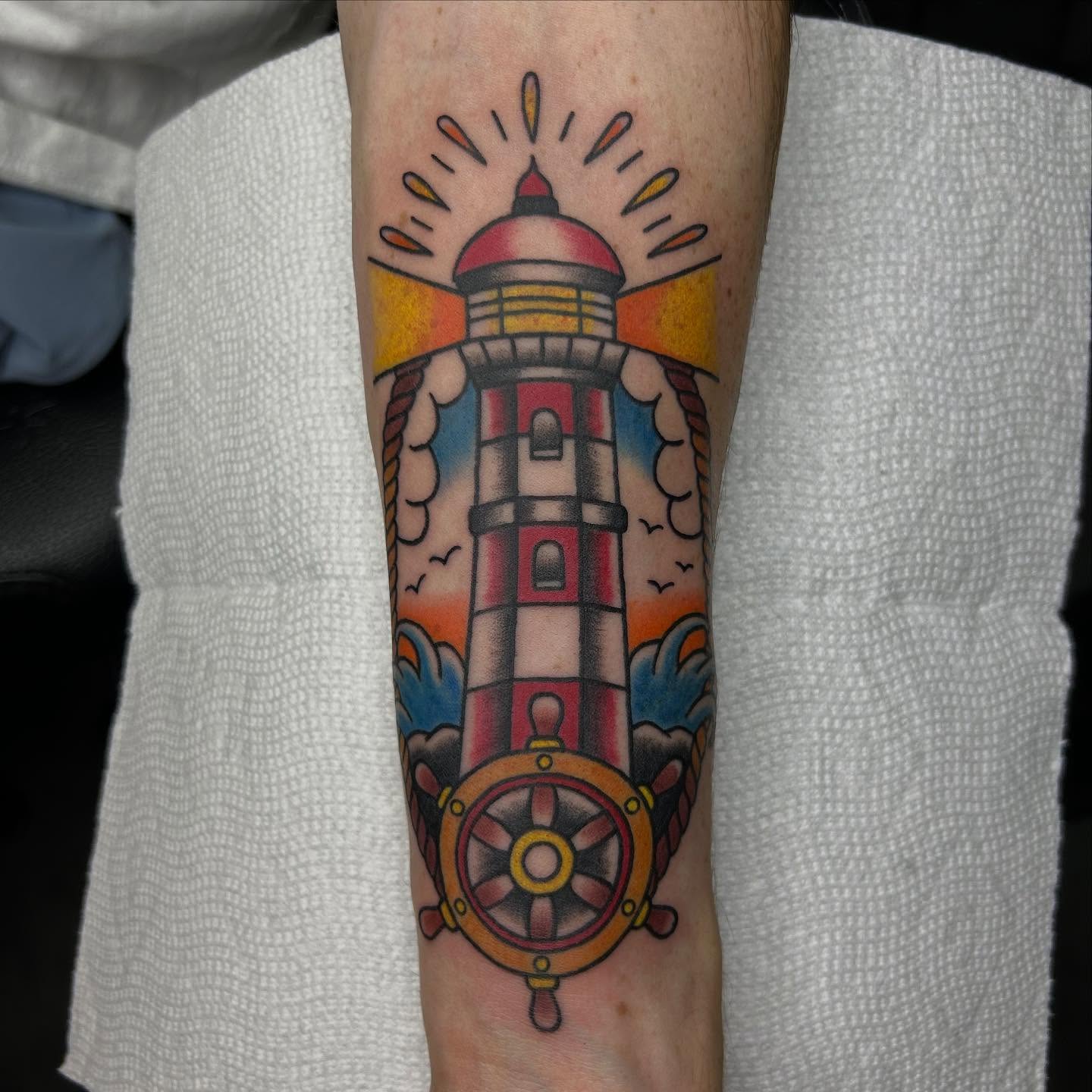 Lighthouse American traditional tattoo on the forearm by Bregan ✨