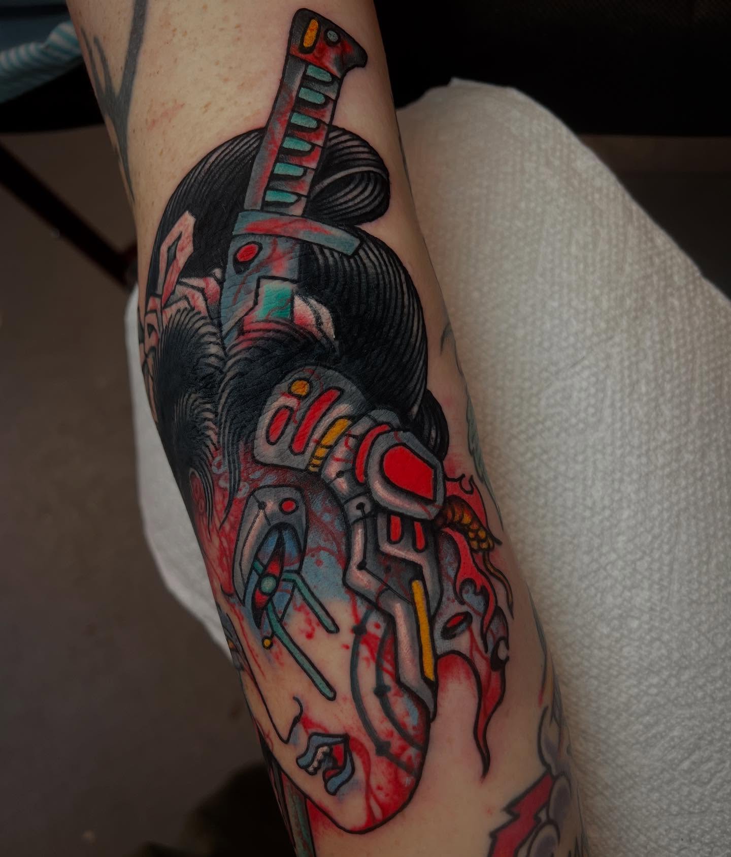 Cyborg warrior geometric tattoo on the forearm by Matt E.