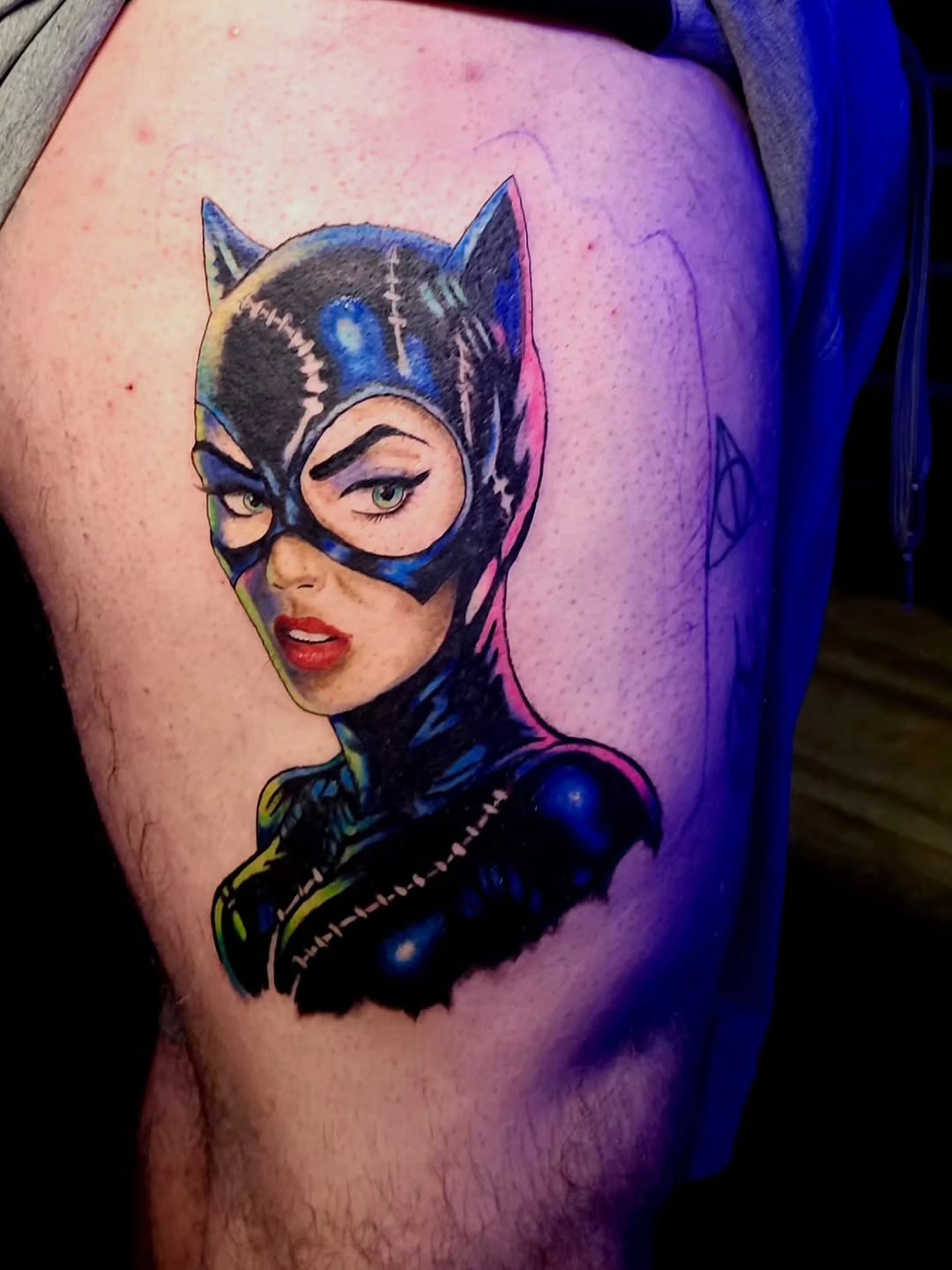 Catwoman portrait realism tattoo on the thigh by Karley Michelle Moody