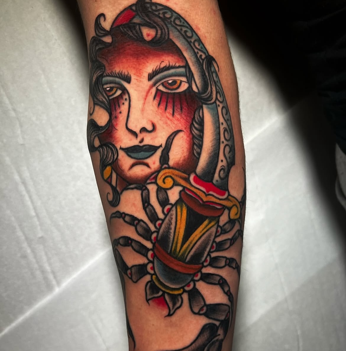 Woman with scorpion American traditional tattoo on the forearm by Alessandro Pennella