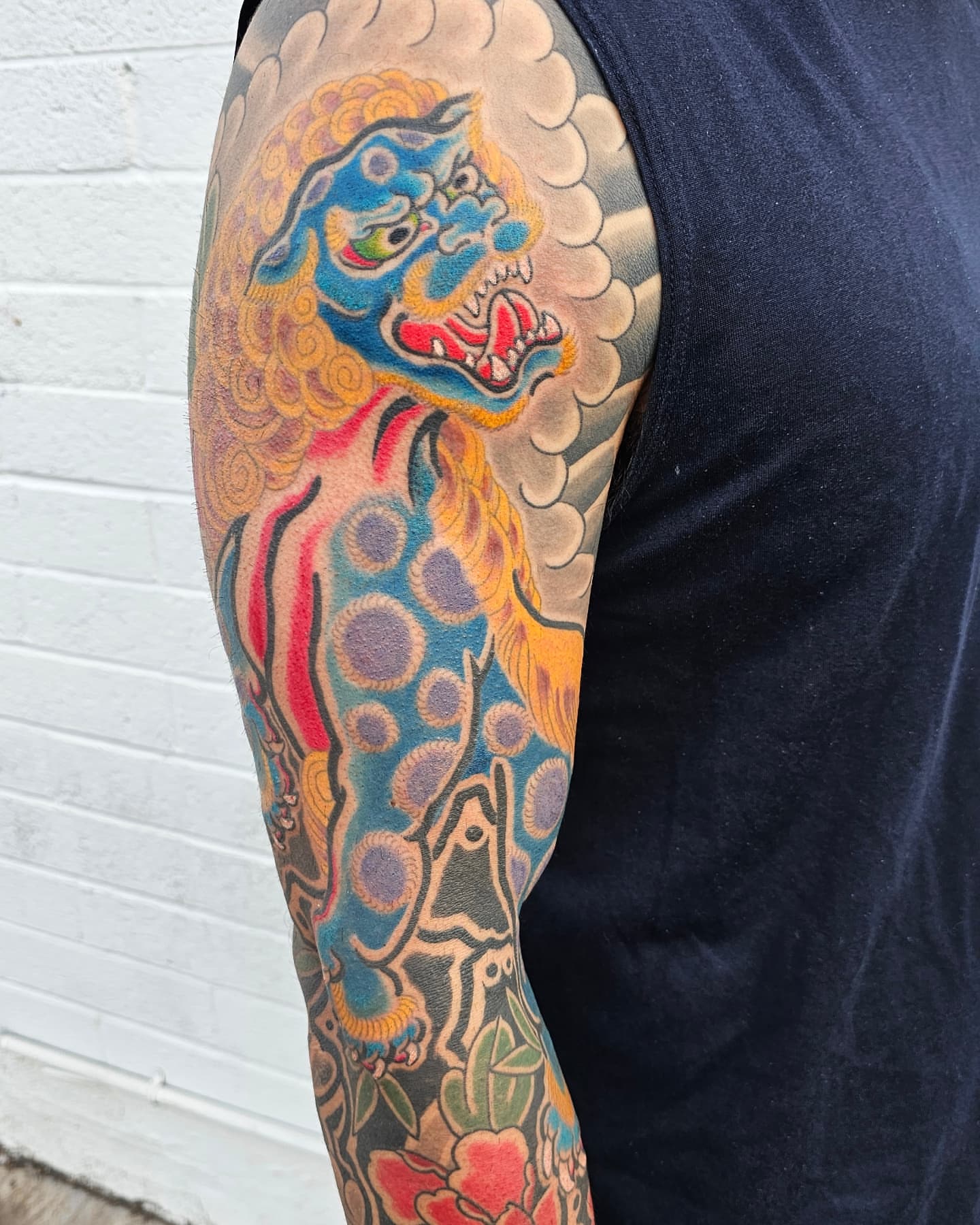 Lion American traditional tattoo on the forearm by Avelourd Legaspi