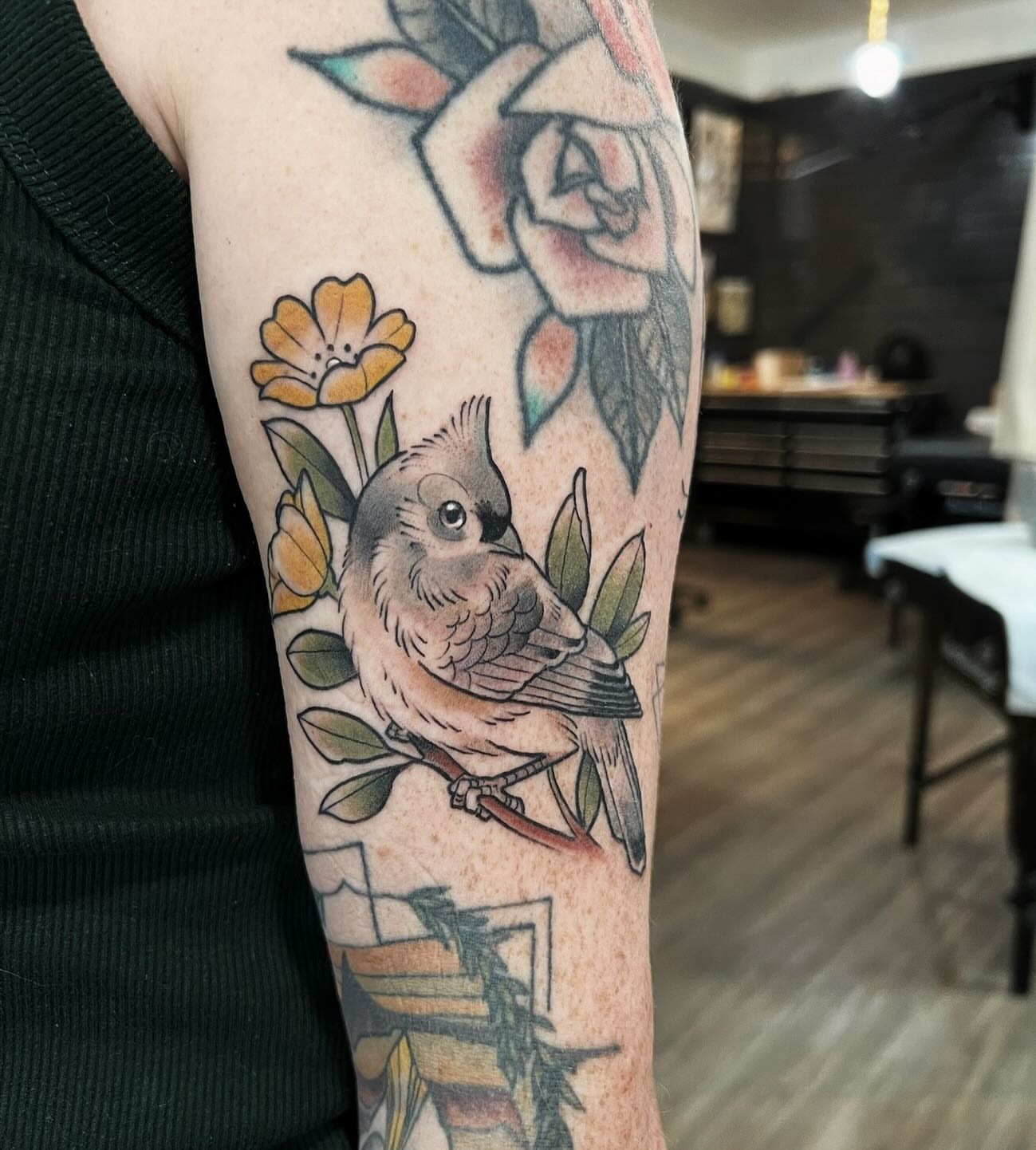 Bird and flowers American traditional tattoo on the forearm by Kyle Olson, Salt Lake City, Utah