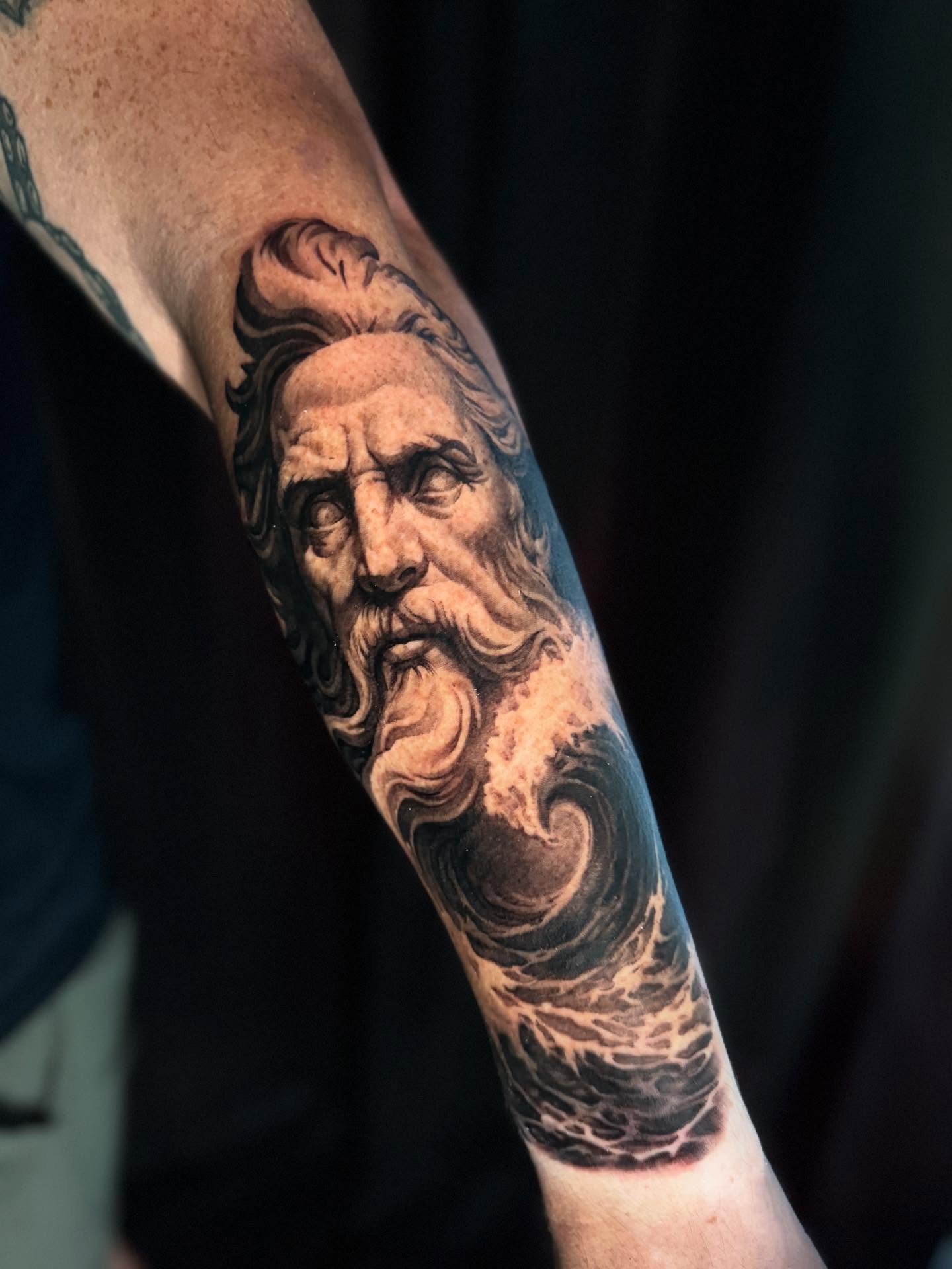 God-like figure realism tattoo on the forearm by 🦇💀Matt Perlman💀🦇